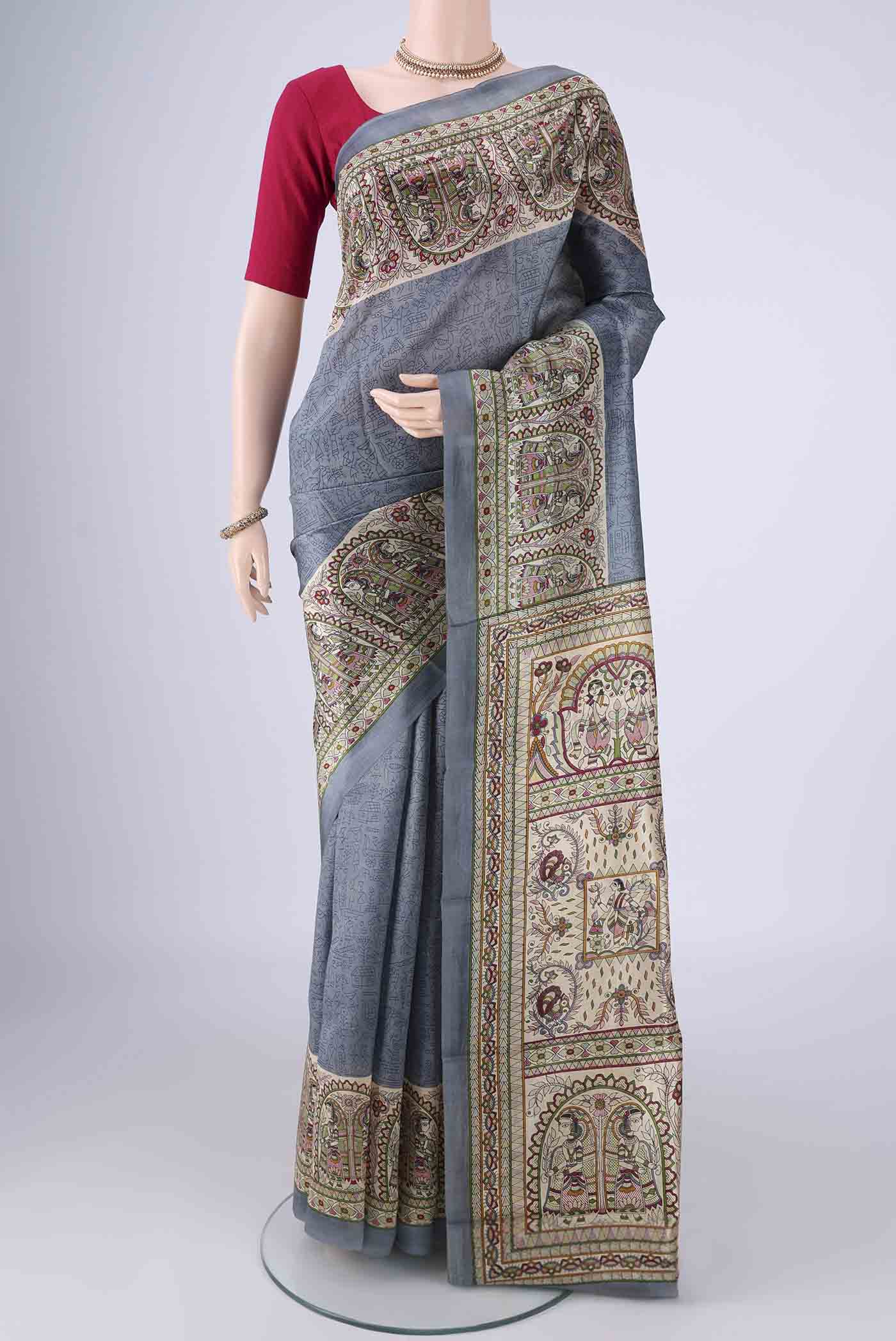 Grey Printed Silk Saree with Printed design on the body and Printed Border.  displayed on a mannequin