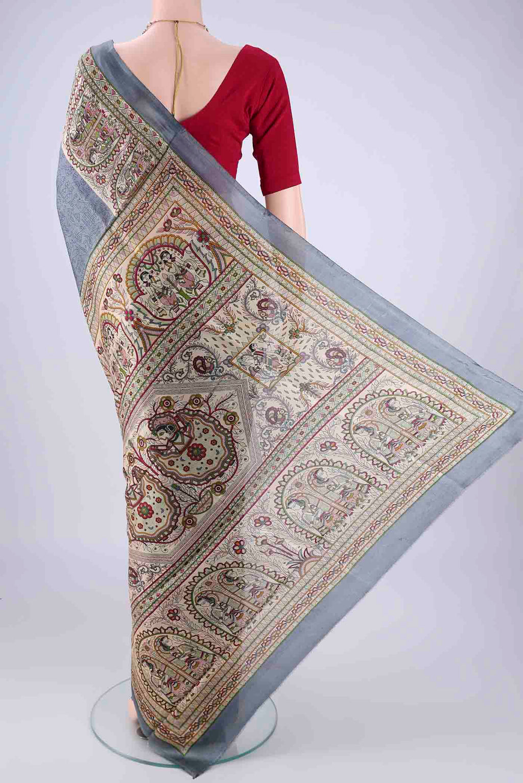 Flat view of Grey Printed Silk Saree with Printed design on the body and Printed Border. 