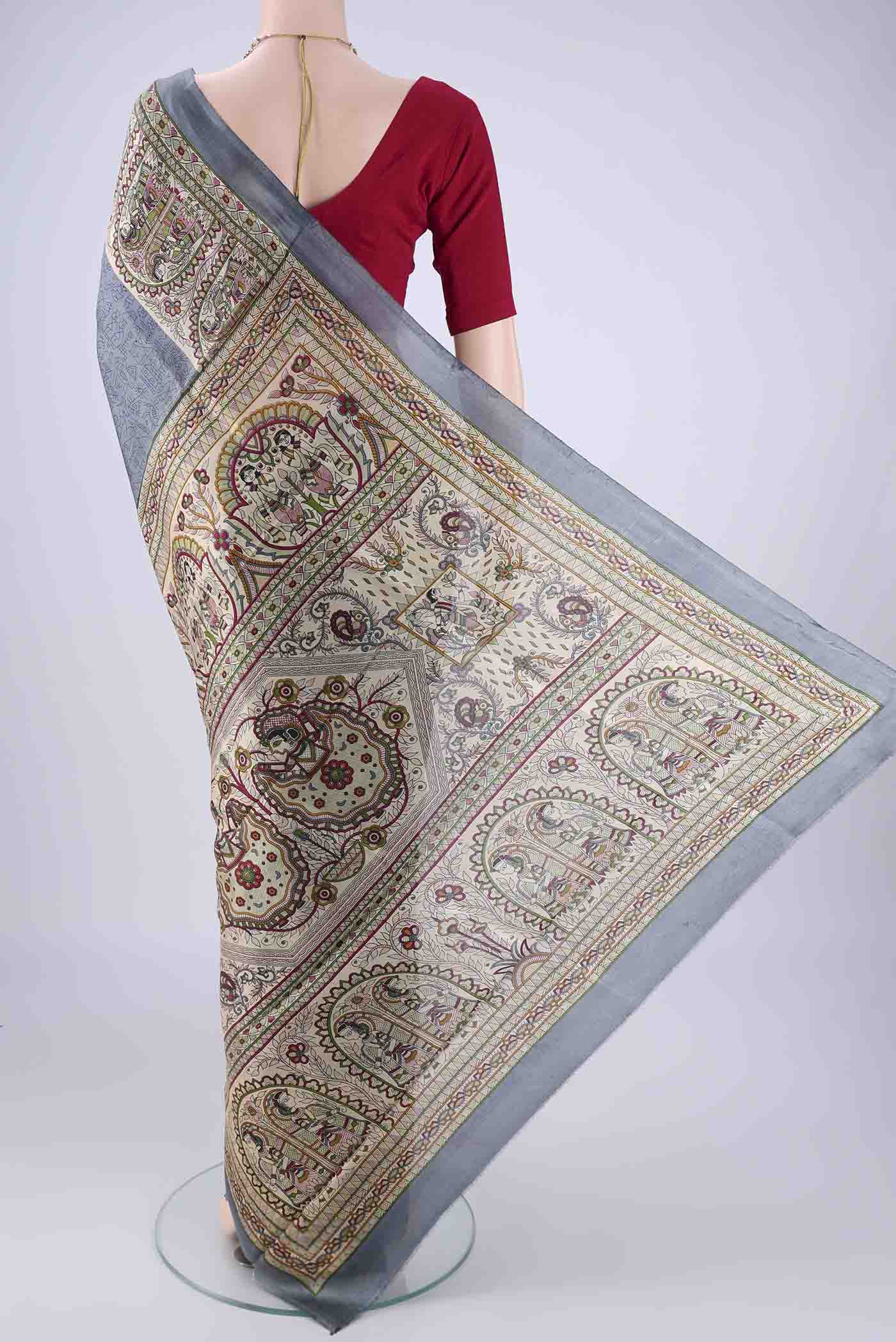 Flat view of Grey Printed Silk Saree with Printed design on the body and Printed Border. 