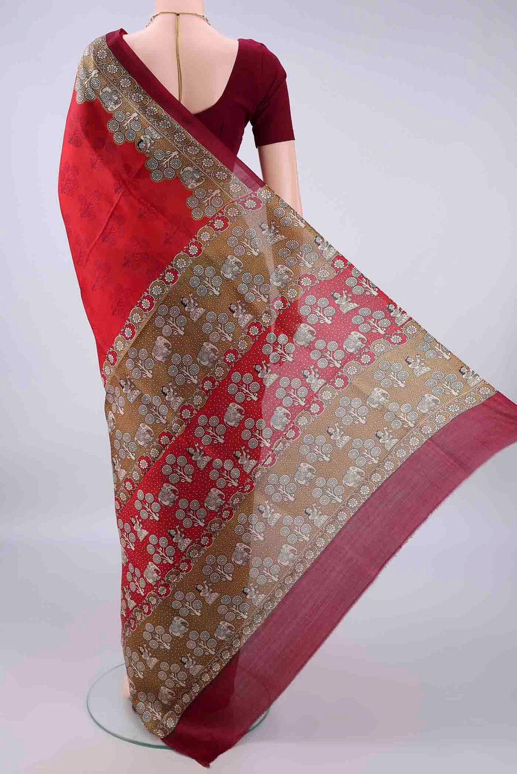 Flat view of Pure Silk Red Printed Saree with Printed design on the body and Printed Border. 