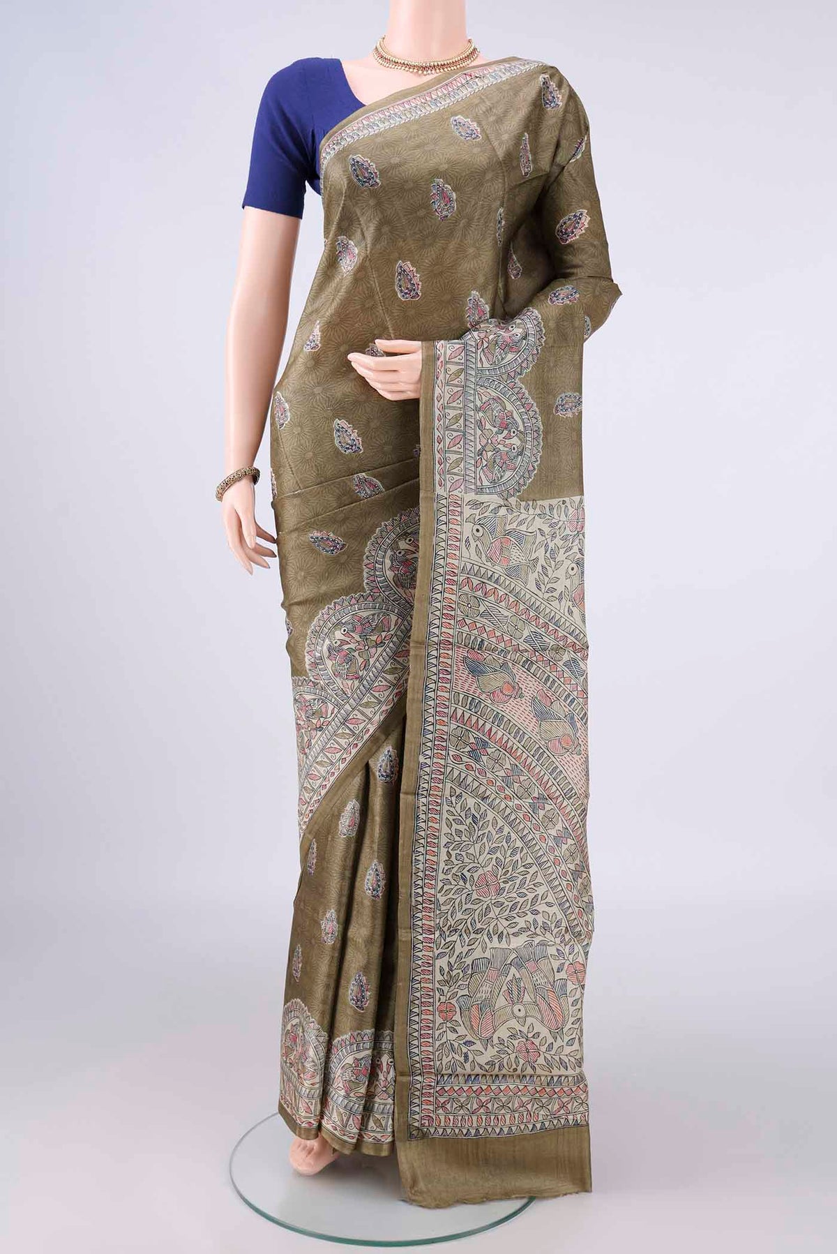 Sage Green Tussar Saree with Printed design on the body and Without Border.  displayed on a mannequin