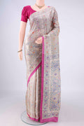 Beige Tussar Saree with Printed design on the body and Printed Border.  displayed on a mannequin