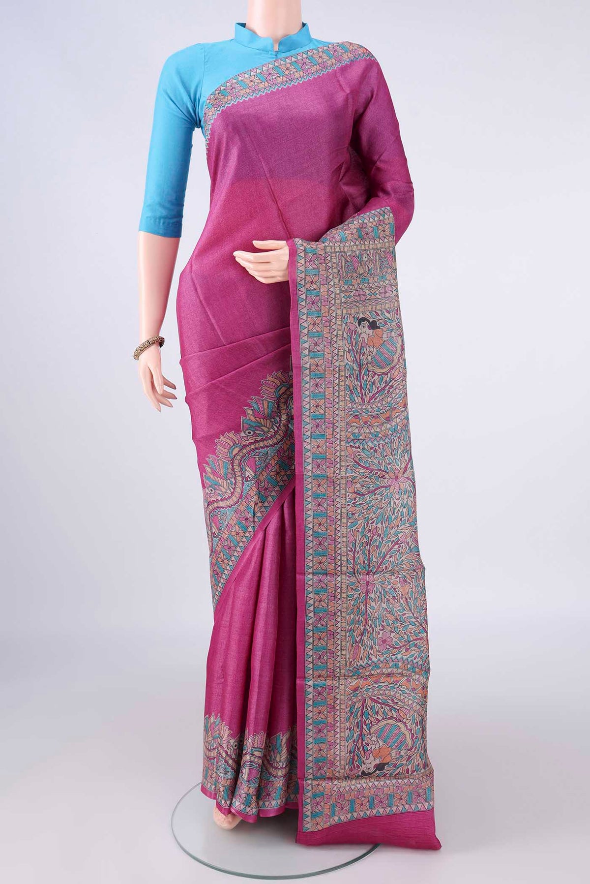 Pink Tussar Saree with Printed design on the body and Printed Border.  displayed on a mannequin