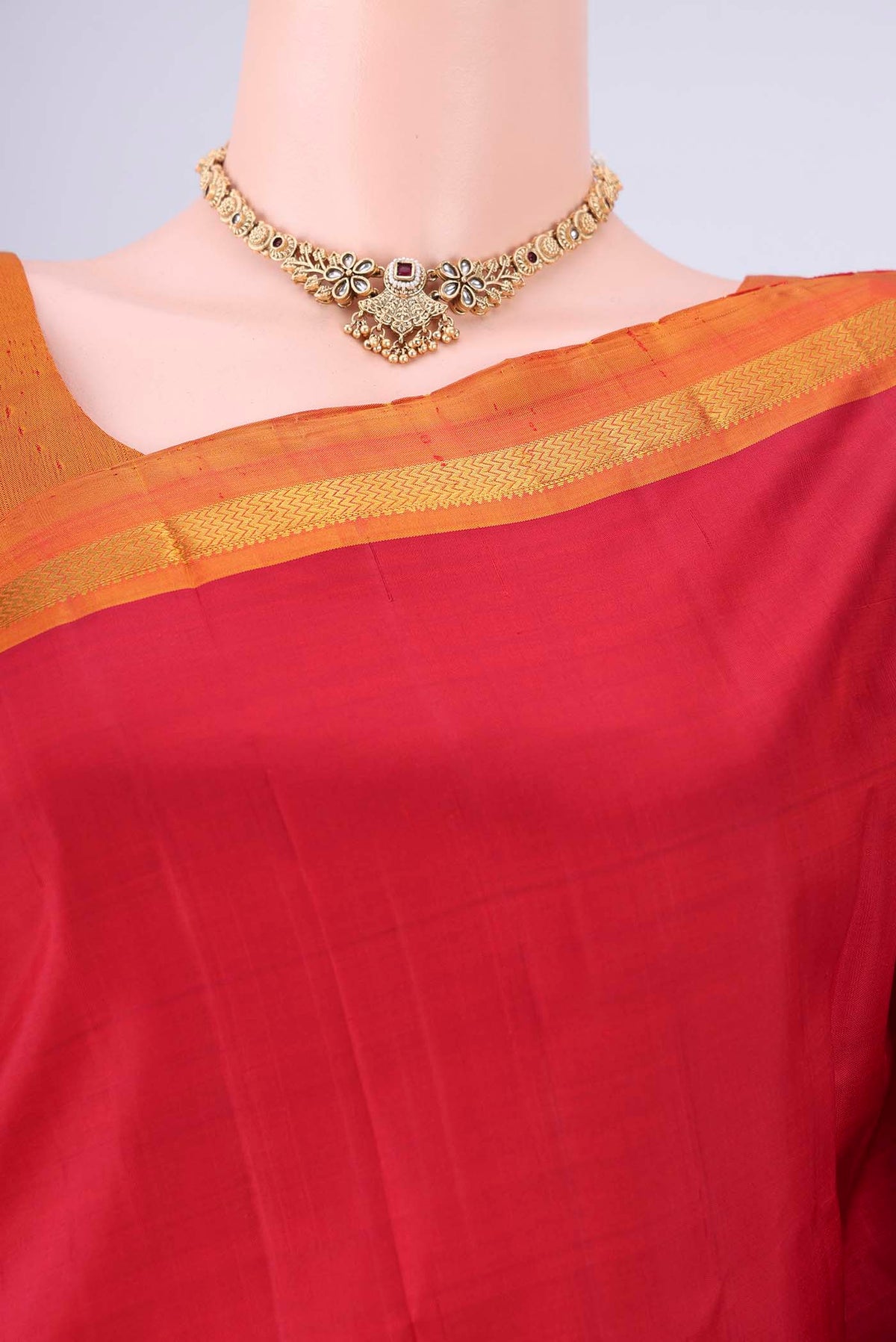 Border image of Red Kanjivaram Silk Saree with Plain Body and Zari Border. 