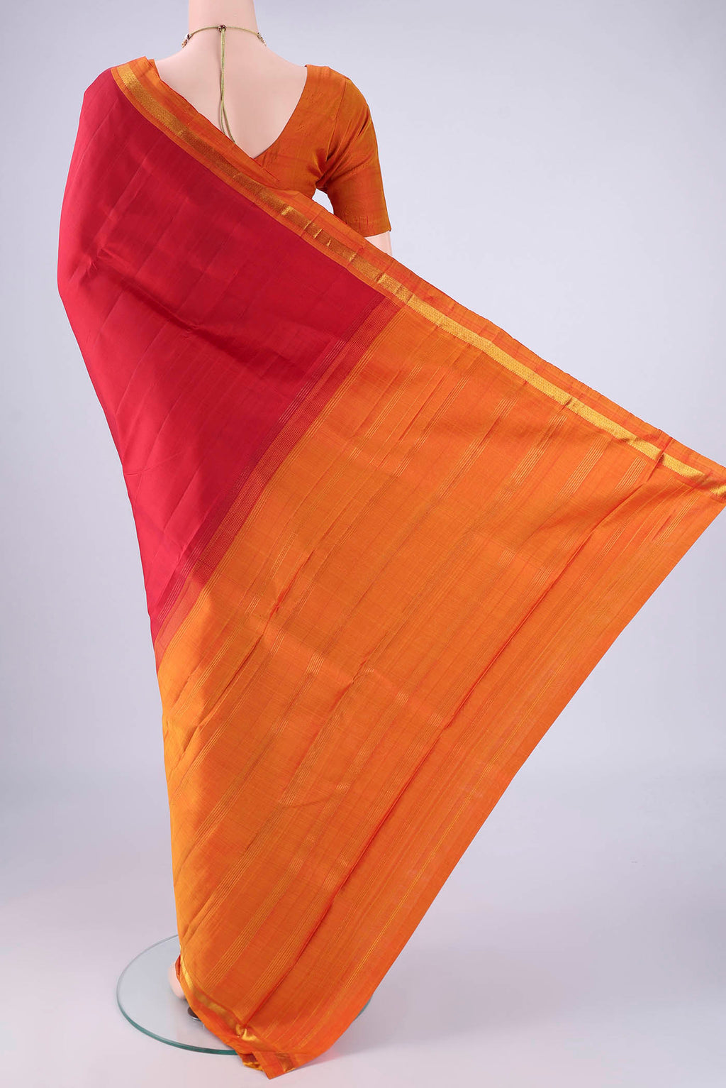 Flat view of Red Kanjivaram Silk Saree with Plain Body and Zari Border. 