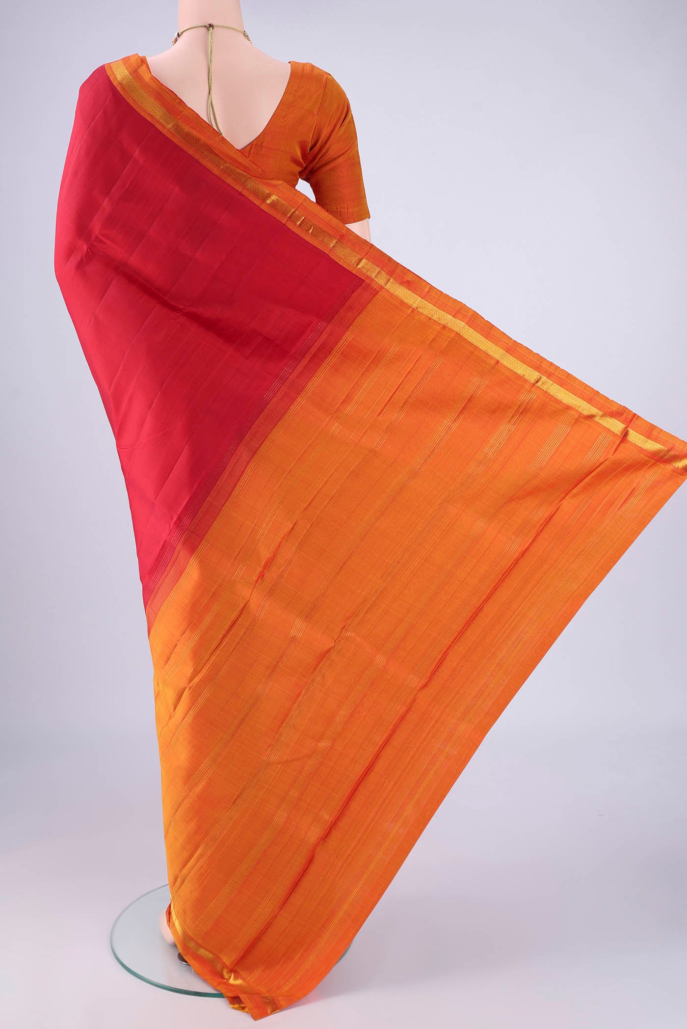 Flat view of Red Kanjivaram Silk Saree with Plain Body and Zari Border. 