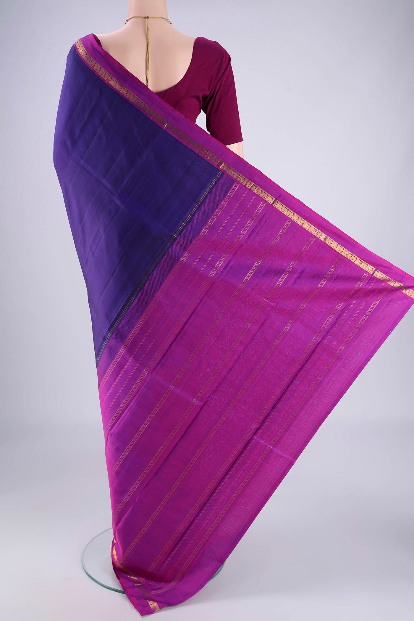 Flat view of Blue Kanjivaram Silk Saree with Plain Body and Zari Border. 