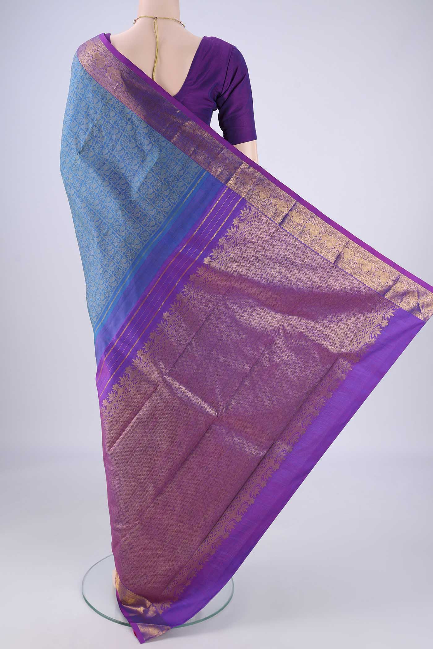 Flat view of Blue Kanjivaram Silk Saree with Jacquard design on the body and Zari Border. 