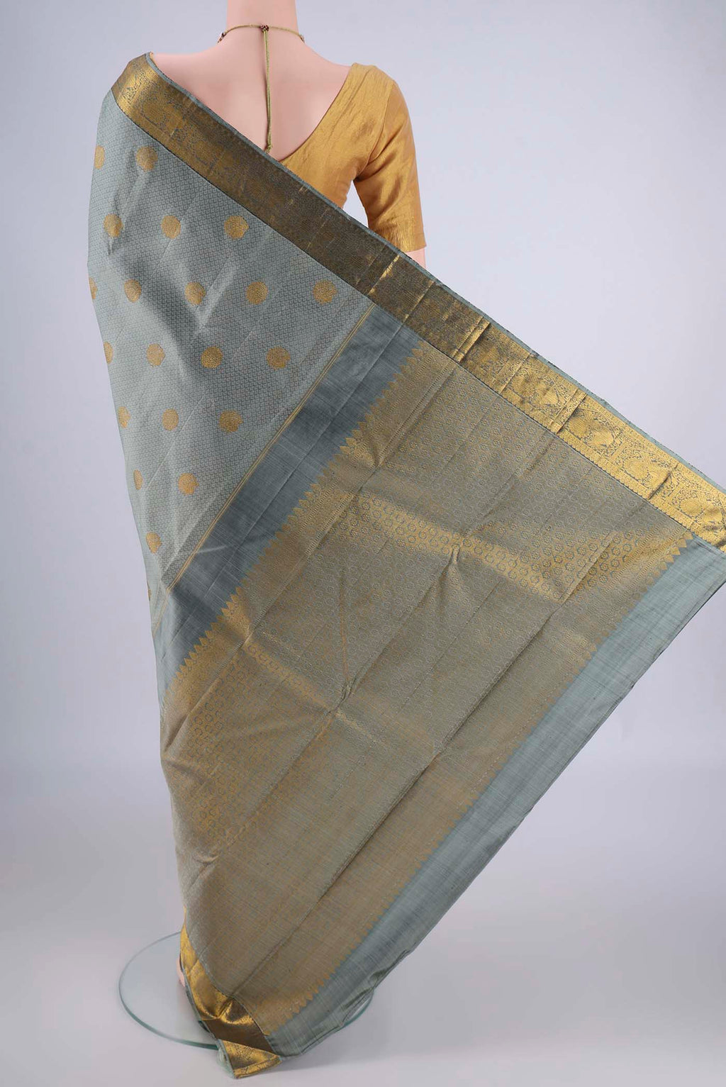 Flat view of Davys Grey Kanjivaram Silk Saree with Jacquard With Zari Butta on the body and Zari Border. 