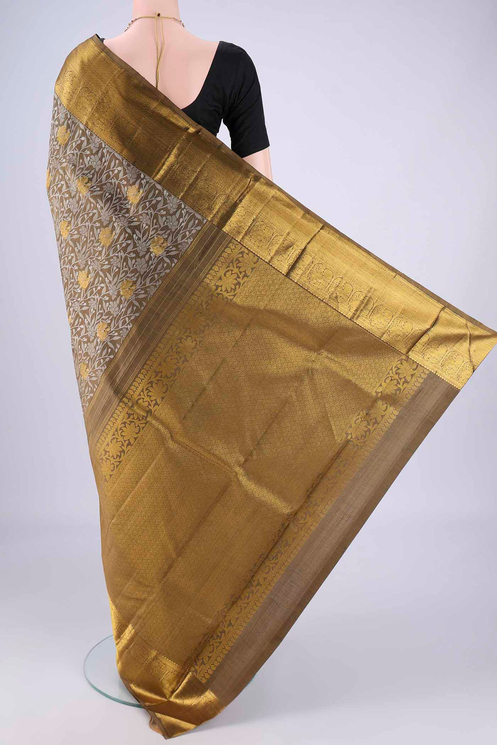 Flat view of Mehandi Green Kanjivaram Silk Saree with Jacquard With Zari Butta on the body and Zari Border. 