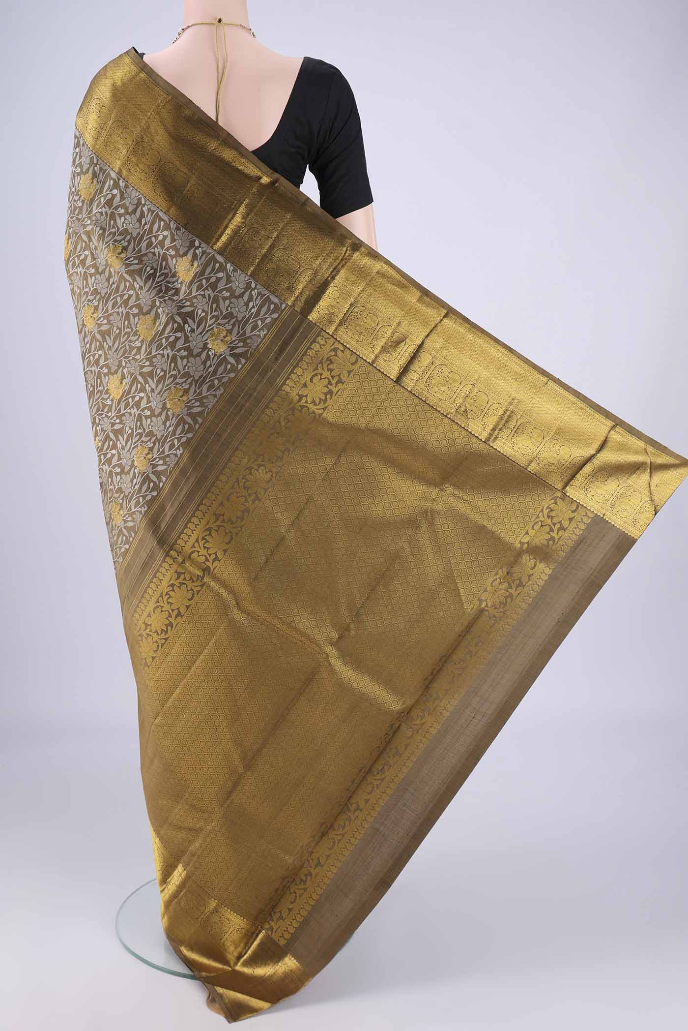 Flat view of Mehandi Green Kanjivaram Silk Saree with Jacquard With Zari Butta on the body and Zari Border. 
