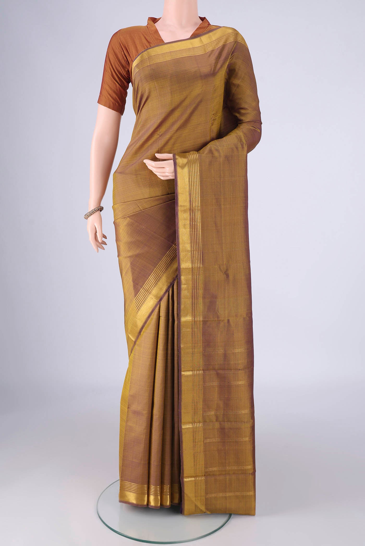 Multi Color Kanjivaram Silk Saree with Plain Body and Zari Border.  displayed on a mannequin