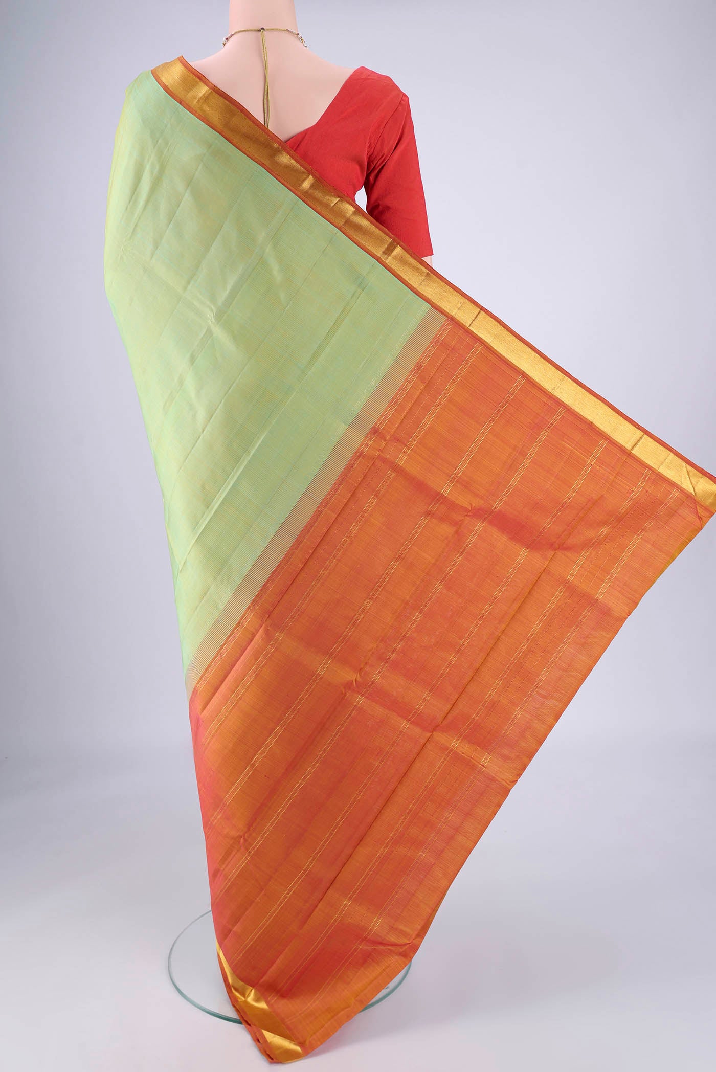 Flat view of Light Green Kanjivaram Silk Saree with Plain Body and Zari Border. 
