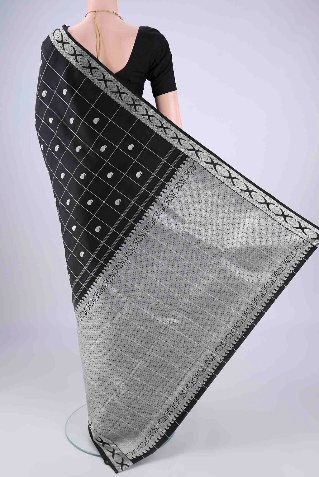 Flat view of Black Kanjivaram Silk Saree with Thread Butta on the body and Thread Border. 