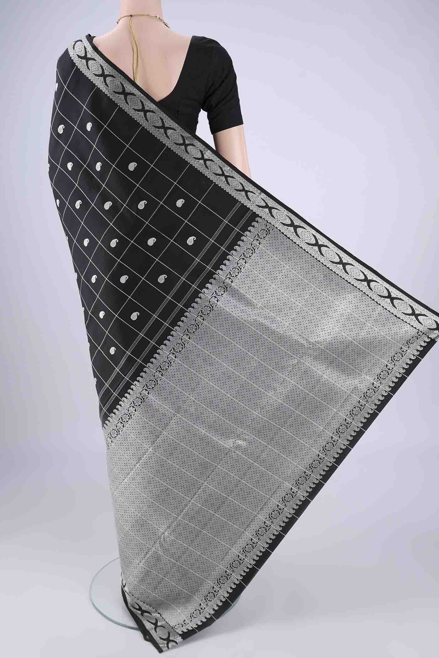 Flat view of Black Kanjivaram Silk Saree with Thread Butta on the body and Thread Border. 