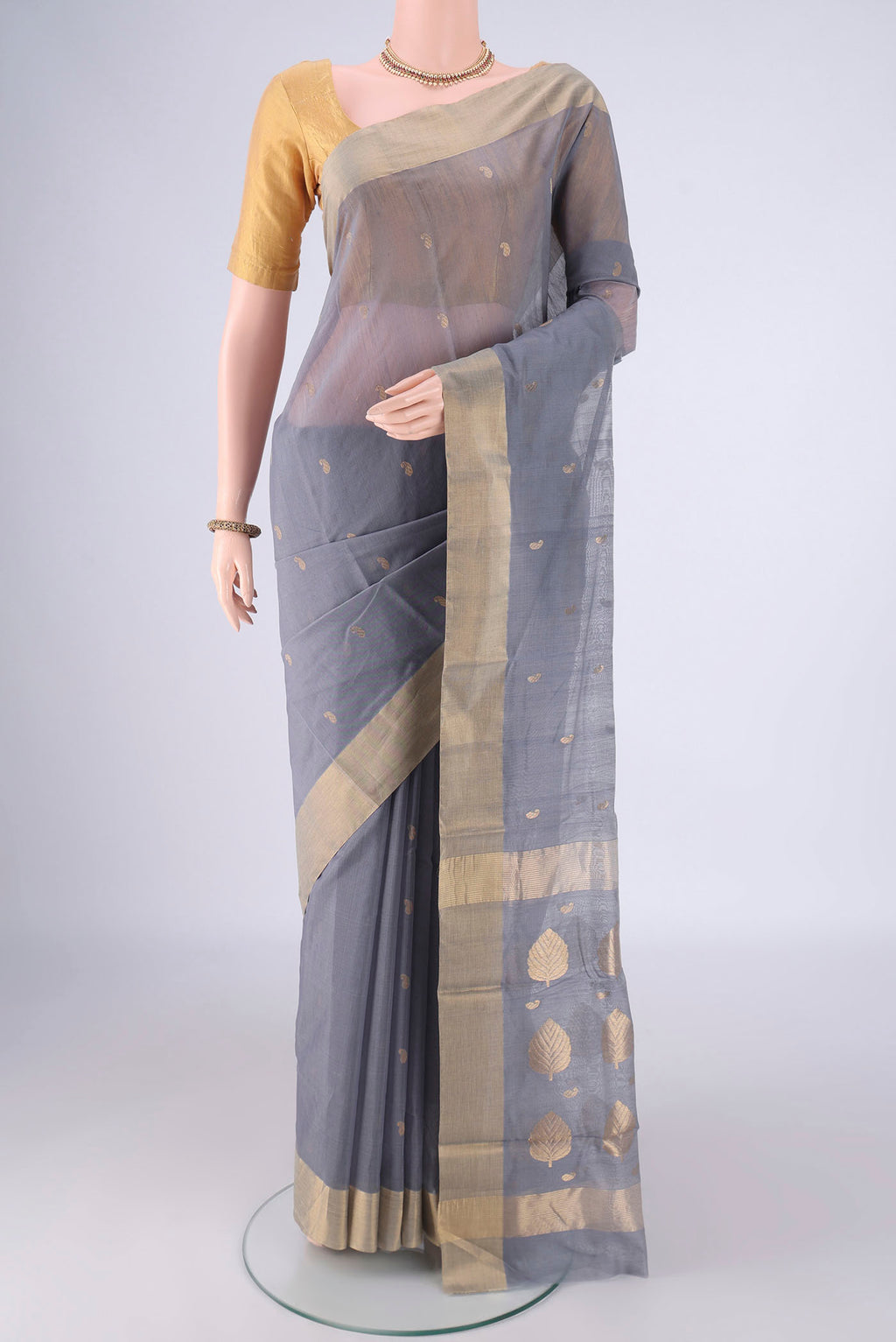 Grey Chanderi Silk Cotton Saree with Zari Butta on the body and Zari Border.  displayed on a mannequin