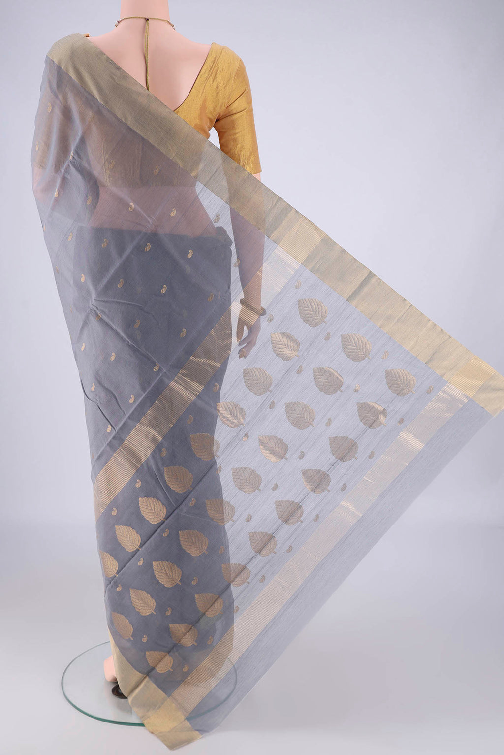 Flat view of Grey Chanderi Silk Cotton Saree with Zari Butta on the body and Zari Border. 