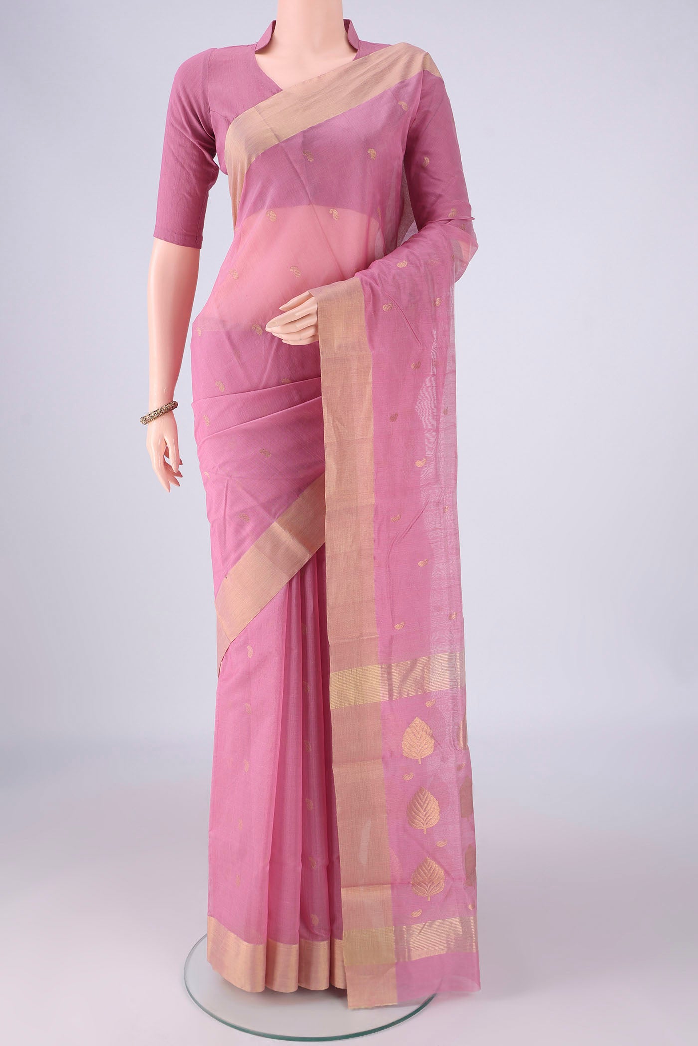 Rose pink Chanderi Silk Cotton Saree with Zari And Thread Butta on the body and Zari Border.  displayed on a mannequin