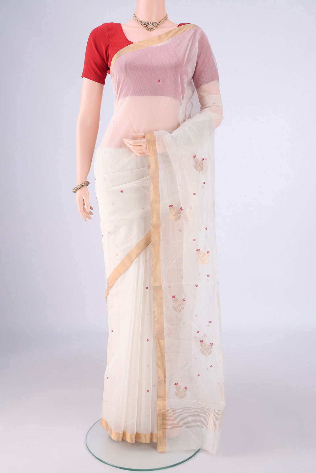 Off White Chanderi Silk Cotton Saree with Zari And Thread Butta on the body and Zari Border.  displayed on a mannequin