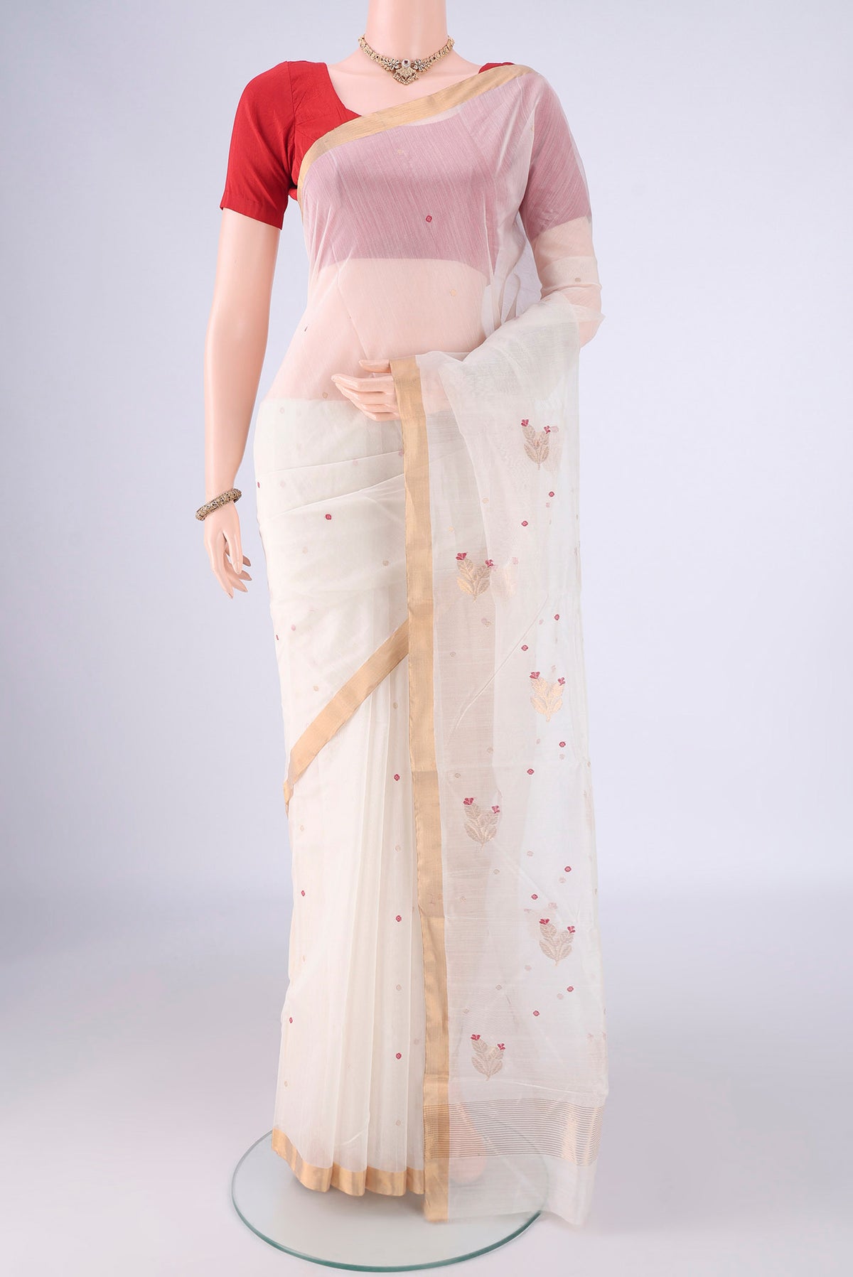 Off White Chanderi Silk Cotton Saree with Zari And Thread Butta on the body and Zari Border.  displayed on a mannequin