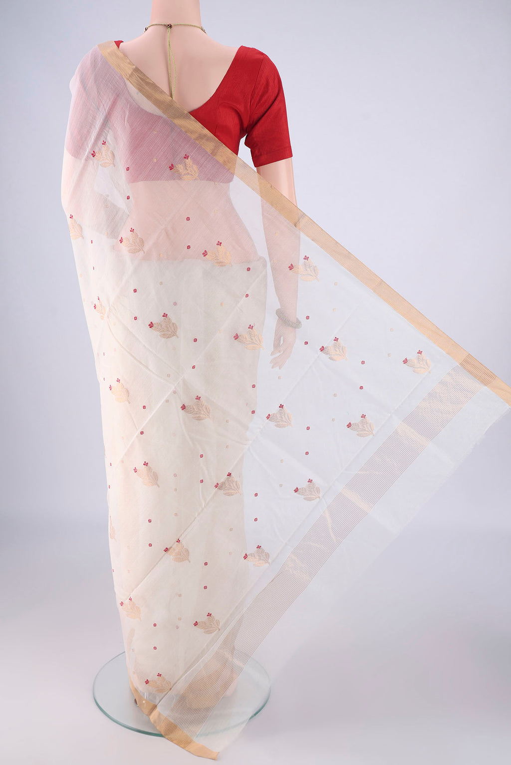 Flat view of Off White Chanderi Silk Cotton Saree with Zari And Thread Butta on the body and Zari Border. 
