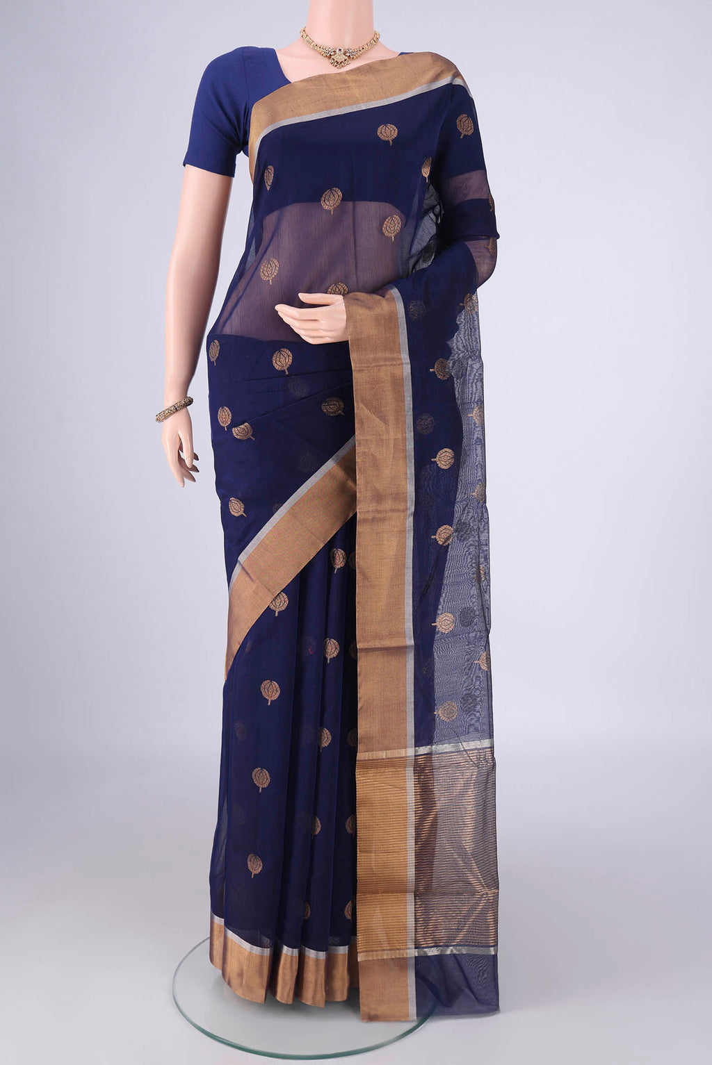 Navy Blue Chanderi Silk Cotton Saree with Zari Butta on the body and Zari Border.  displayed on a mannequin
