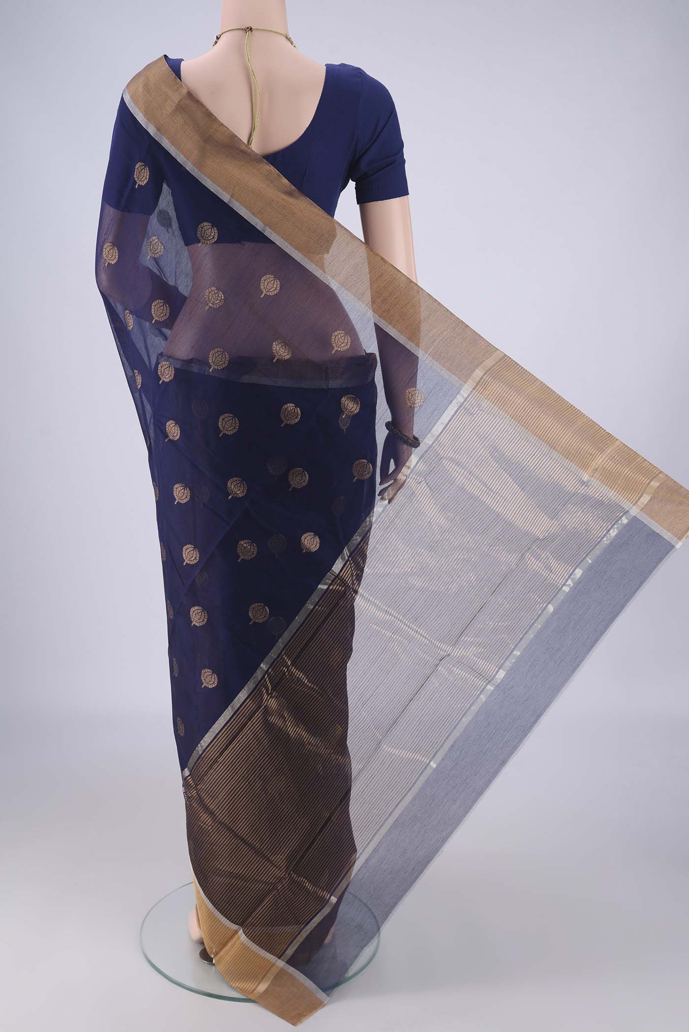 Flat view of Navy Blue Chanderi Silk Cotton Saree with Zari Butta on the body and Zari Border. 