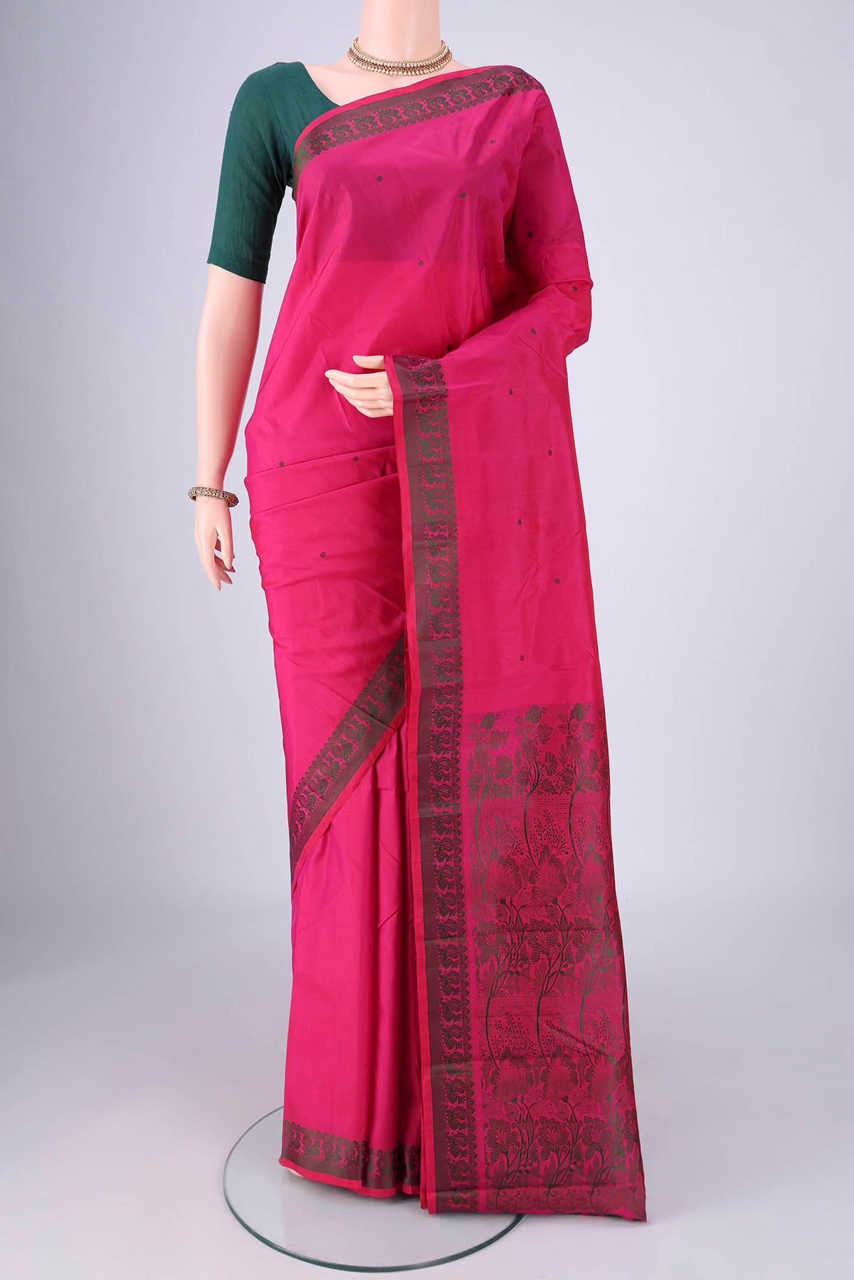 Rani Pink Kanchipuram Silk Saree with Thread Butta on the body and Thread Border.  displayed on a mannequin