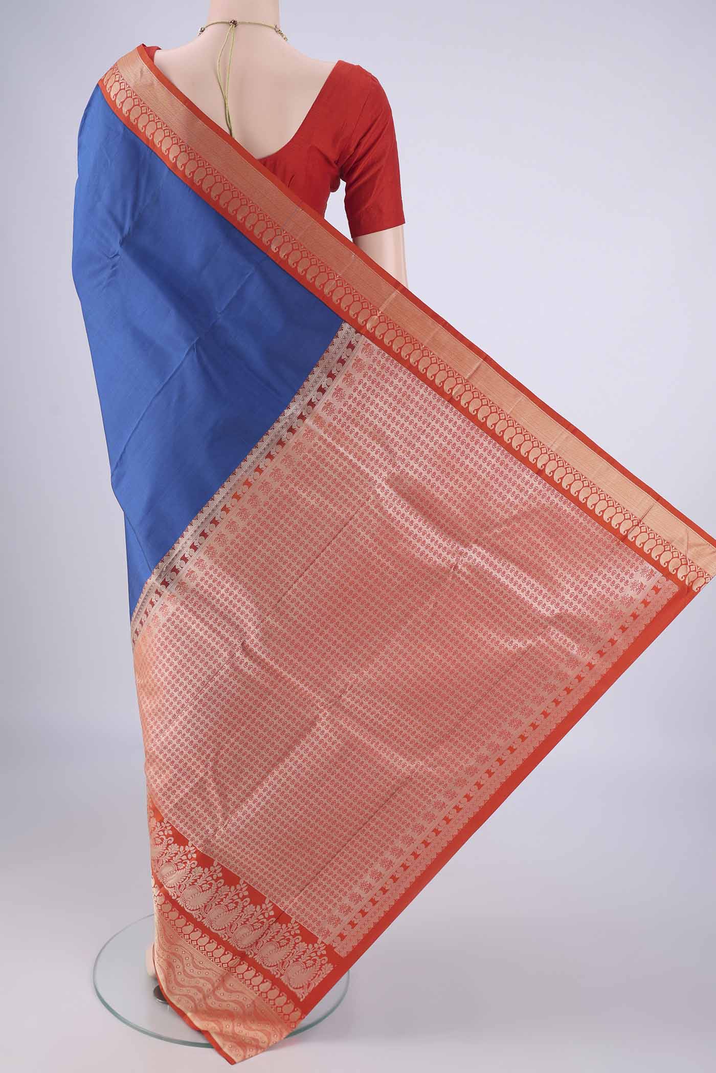 Flat view of Blue Kanjivaram Silk Saree with Plain Body and Thread Border. 