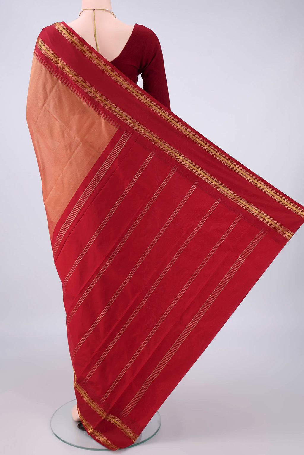 Flat view of Peach Blended Bangalore Silk Saree with Plain Body and Zari Border. 