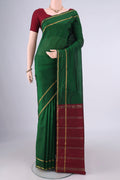 Bottle Green Blended Bangalore Silk Saree with Zari Butta on the body and Zari Border.  displayed on a mannequin
