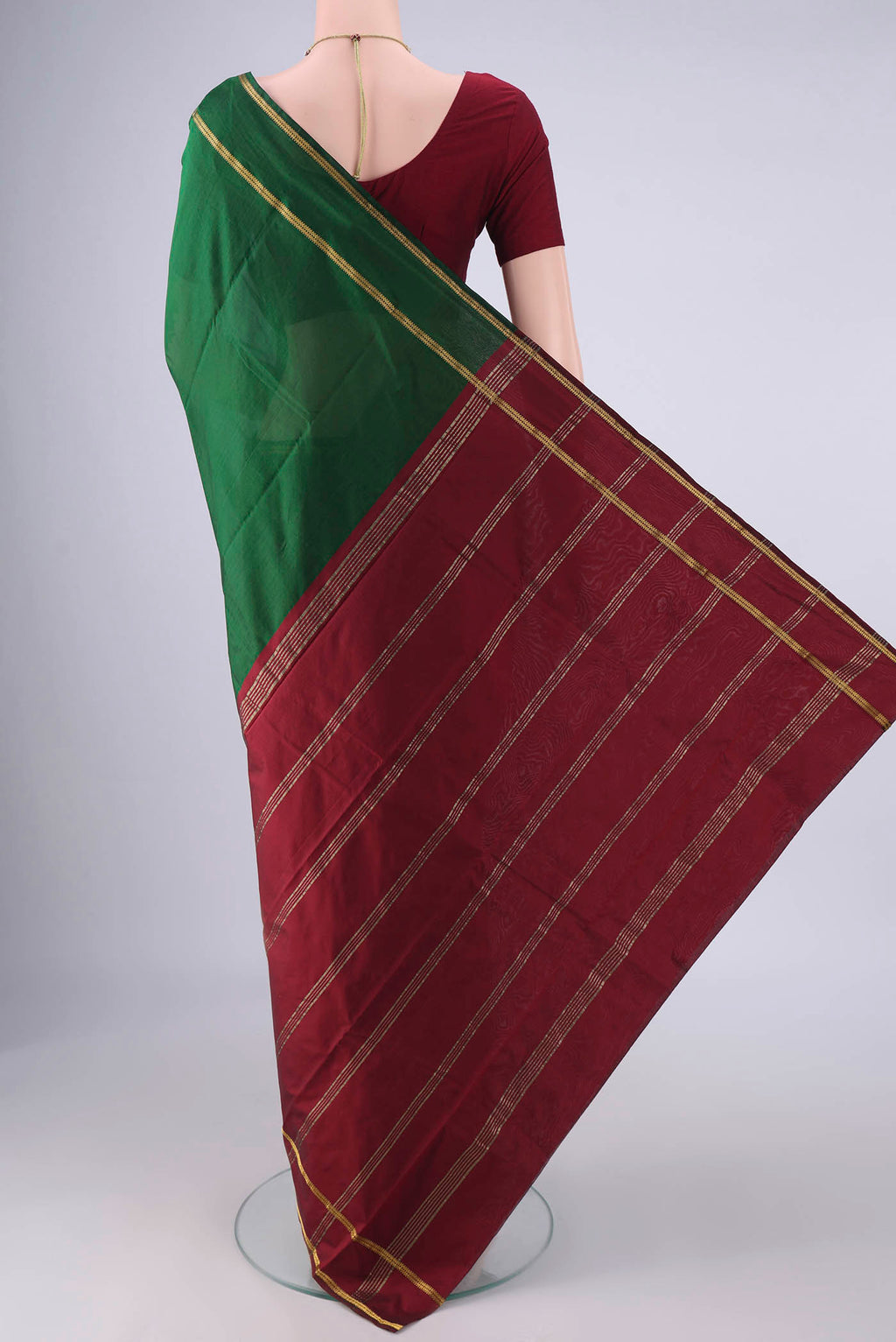 Flat view of Bottle Green Blended Bangalore Silk Saree with Zari Butta on the body and Zari Border. 