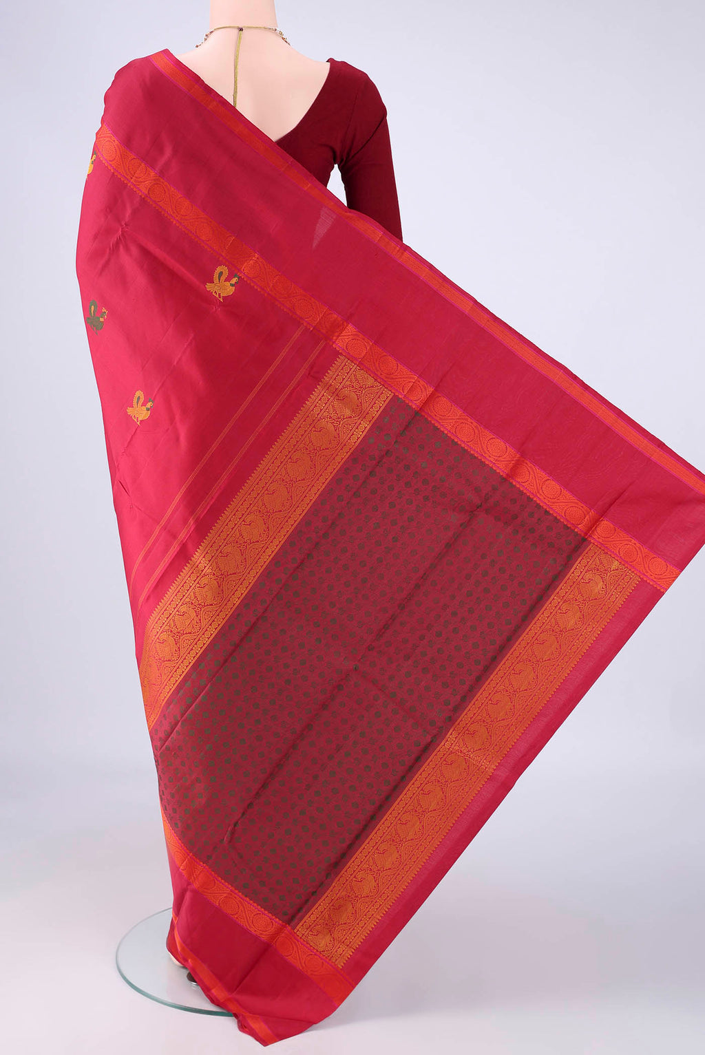 Flat view of Maroon Kanchipuram Silk Saree with Thread Butta on the body and Thread Border. 