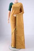 Dark Beige Dual Tone Kanjivaram Silk Saree with Zari Butta on the body and Zari Border.  displayed on a mannequin
