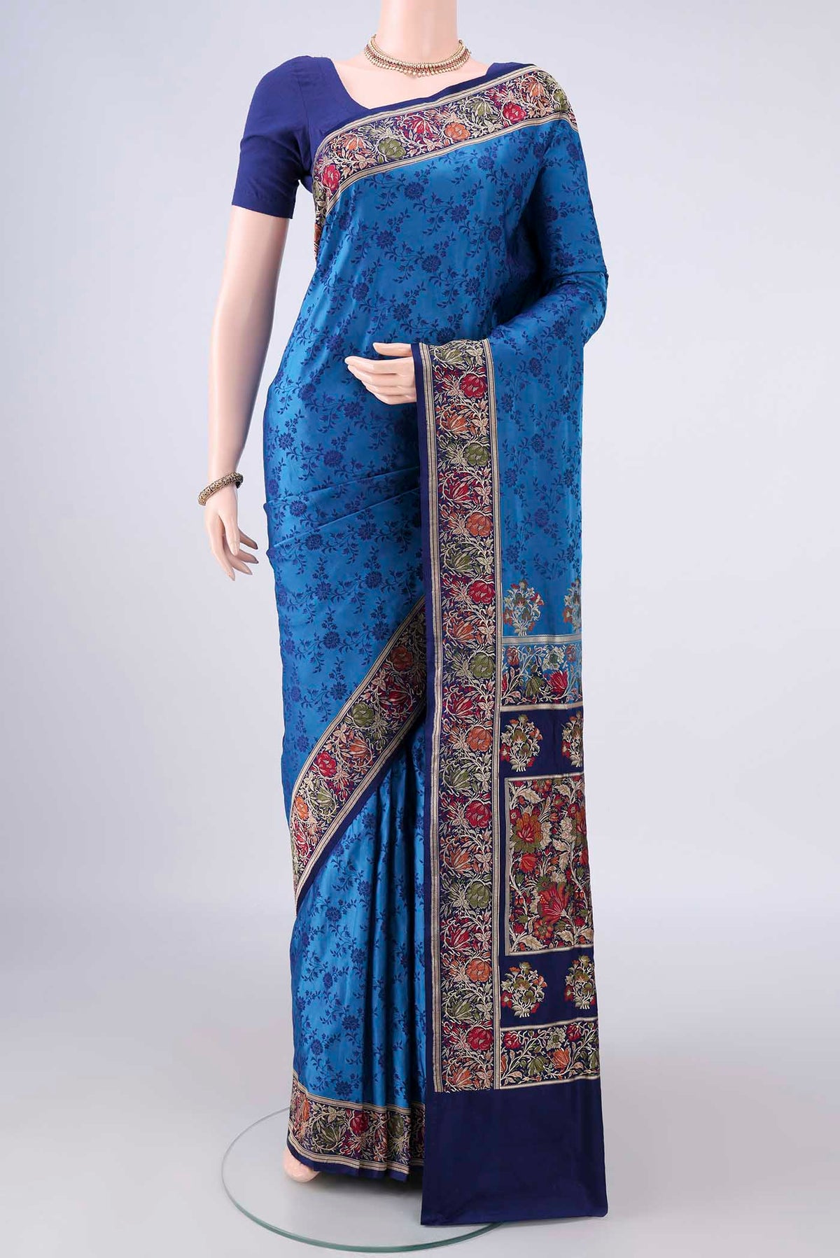 Dark Blue Banarasi Jamavar Saree with Thread Brocade on the body and Zari Border.  displayed on a mannequin