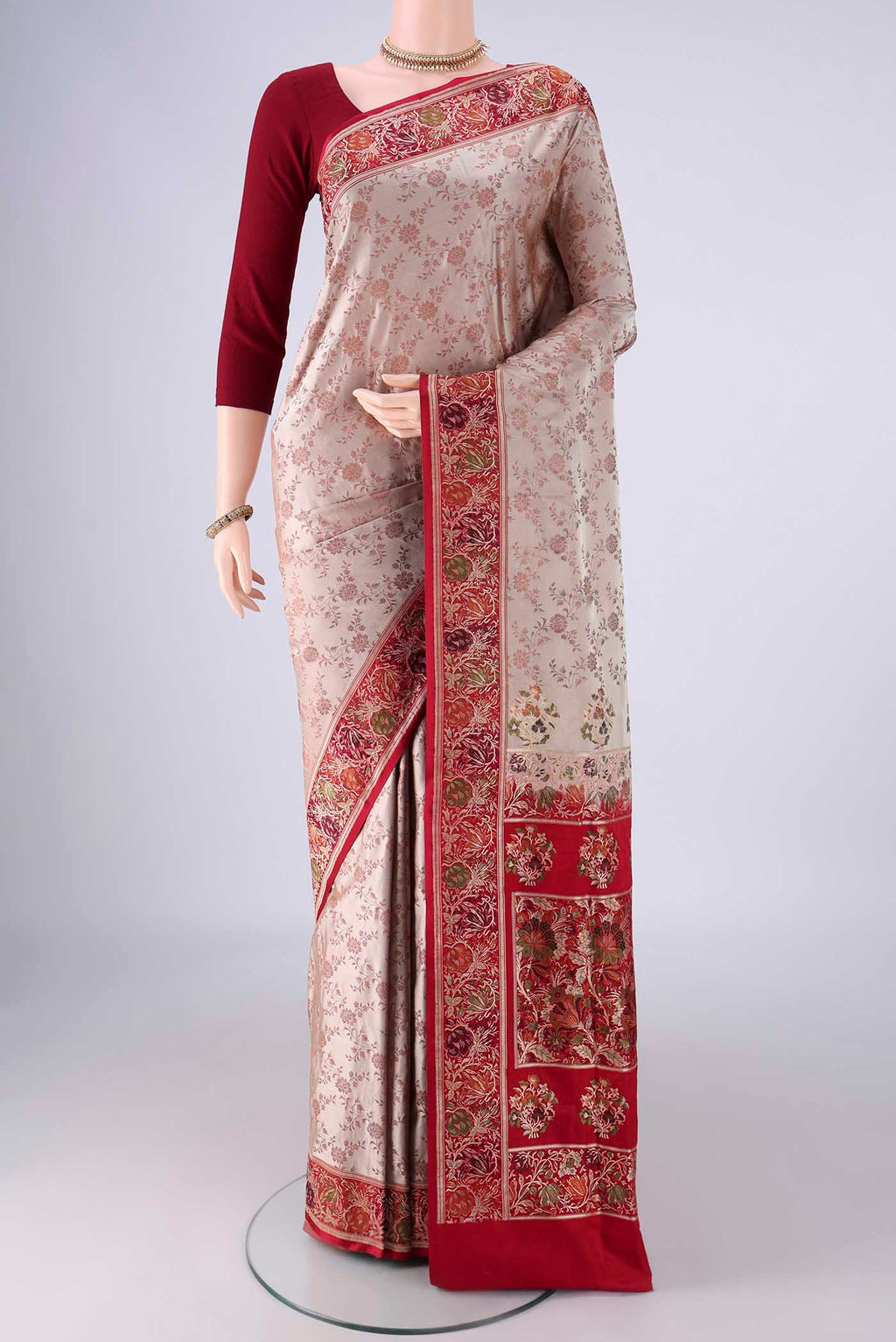 Beige Banarasi Jamavar Saree with Thread Brocade on the body and Zari Border.  displayed on a mannequin