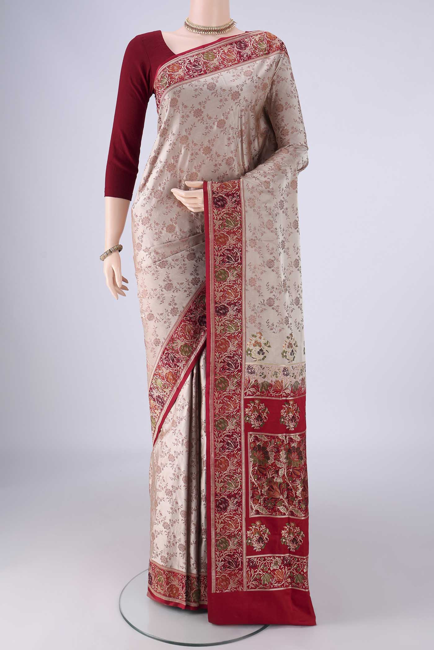 Beige Banarasi Jamavar Saree with Thread Brocade on the body and Zari Border.  displayed on a mannequin