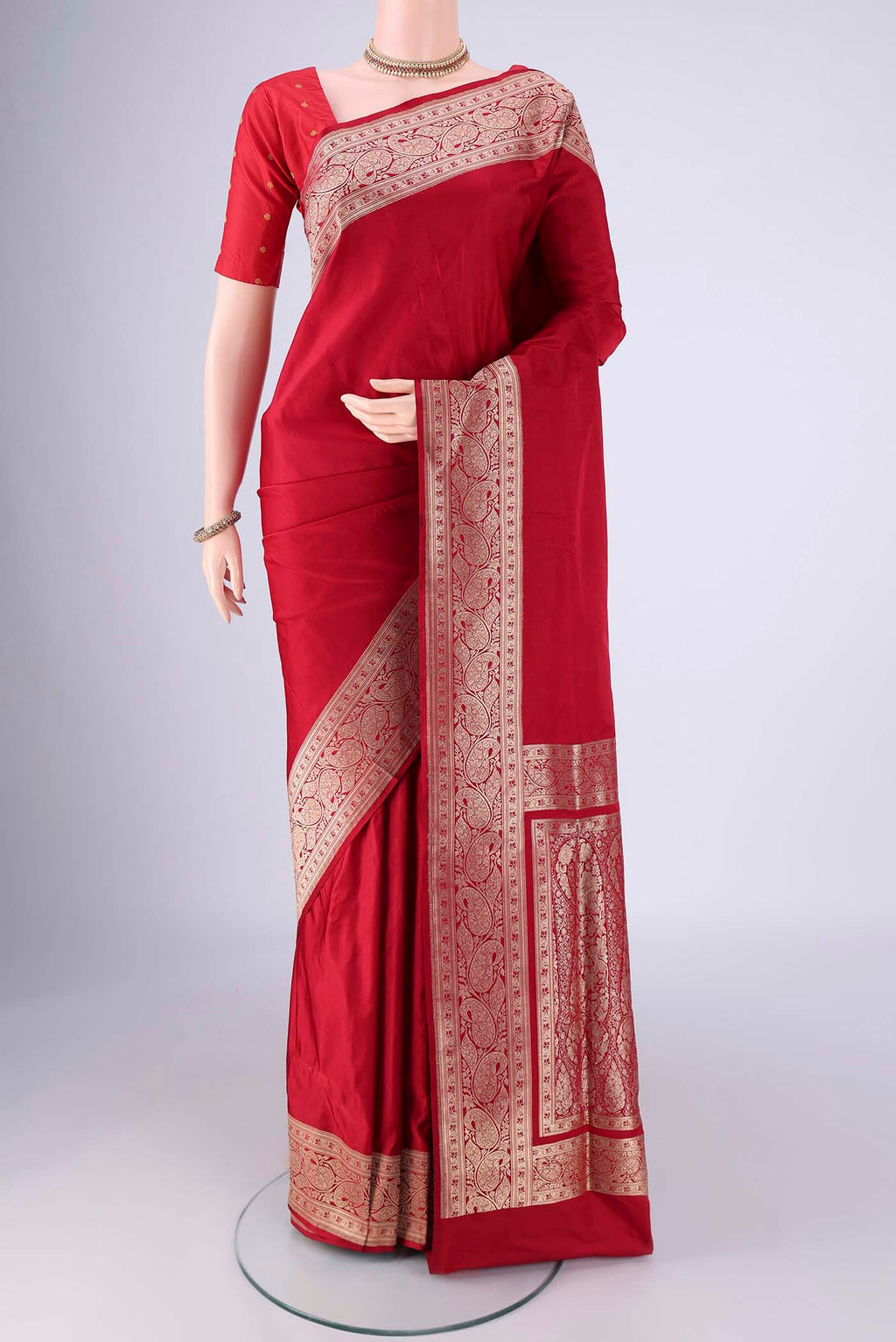 Deep Red Banarasi Silk Saree with Plain Body and Zari Border.  displayed on a mannequin
