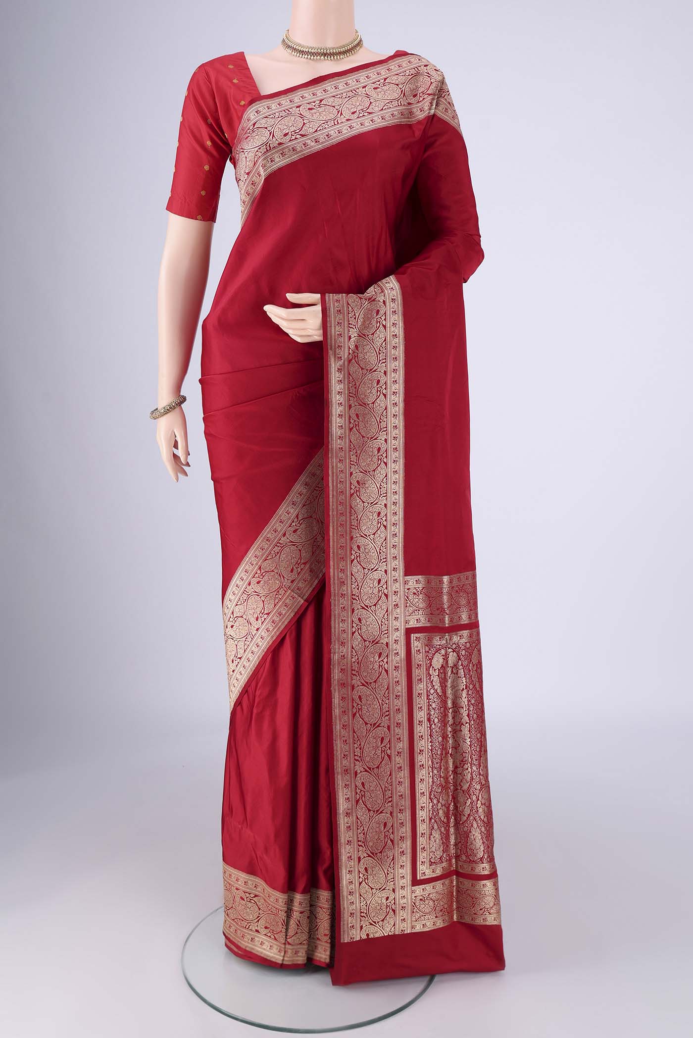 Deep Red Banarasi Silk Saree with Plain Body and Zari Border.  displayed on a mannequin
