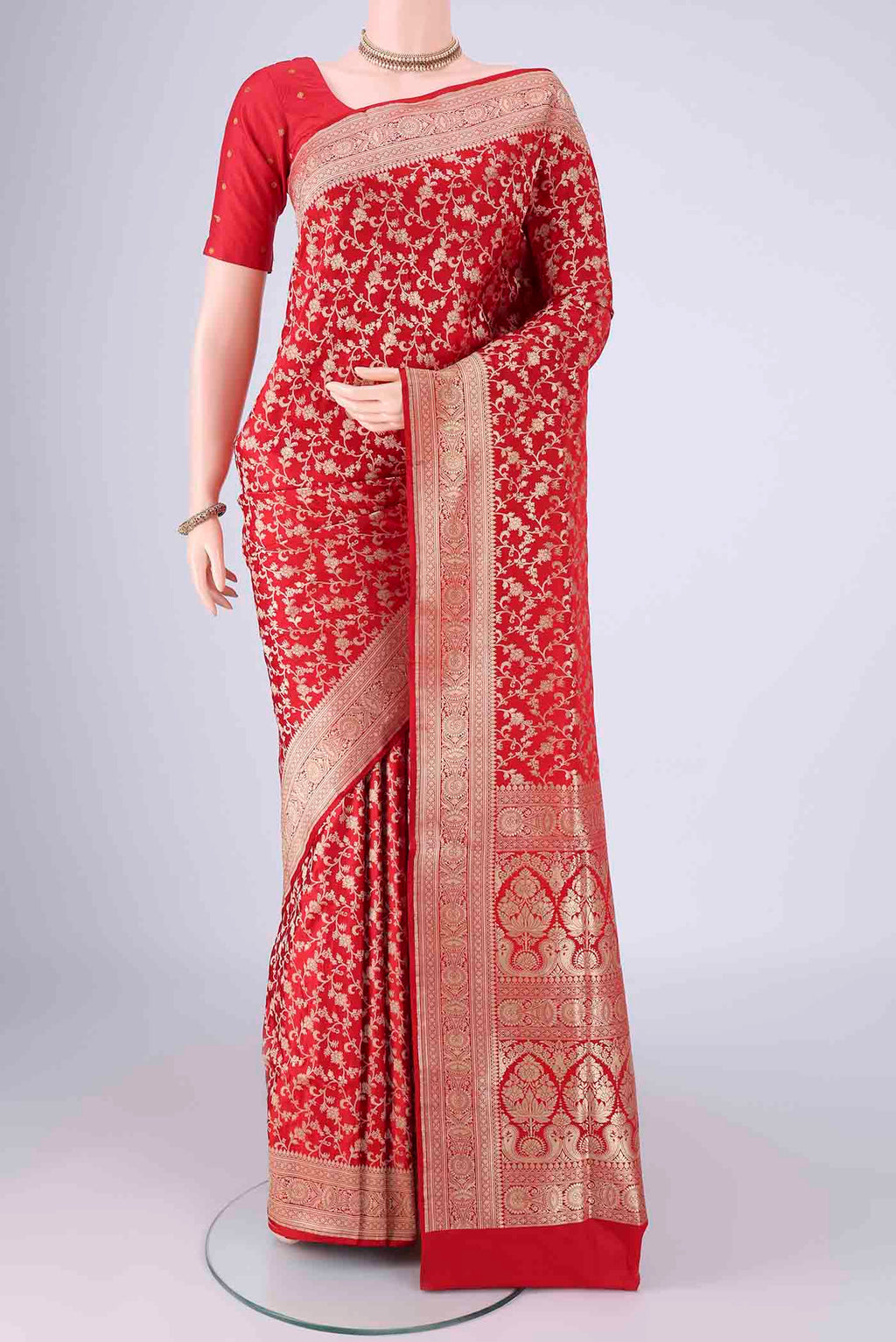 Red Banarasi Silk Saree with Zari Brocade on the body and Zari Border.  displayed on a mannequin