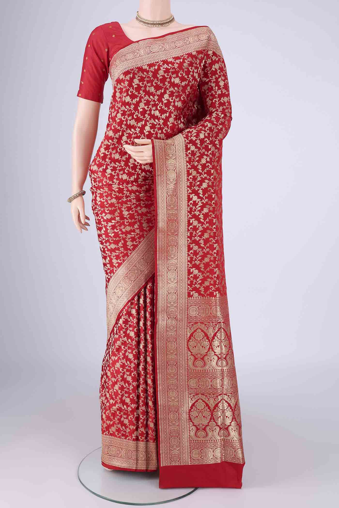 Red Banarasi Silk Saree with Zari Brocade on the body and Zari Border.  displayed on a mannequin