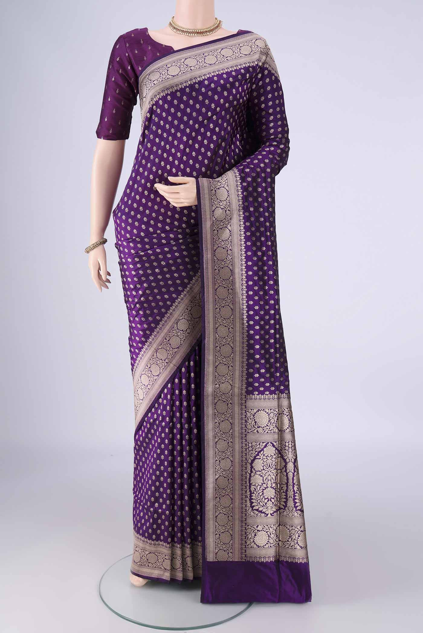 Purple Banarasi Silk Saree with Zari Butta on the body and Zari Border.  displayed on a mannequin