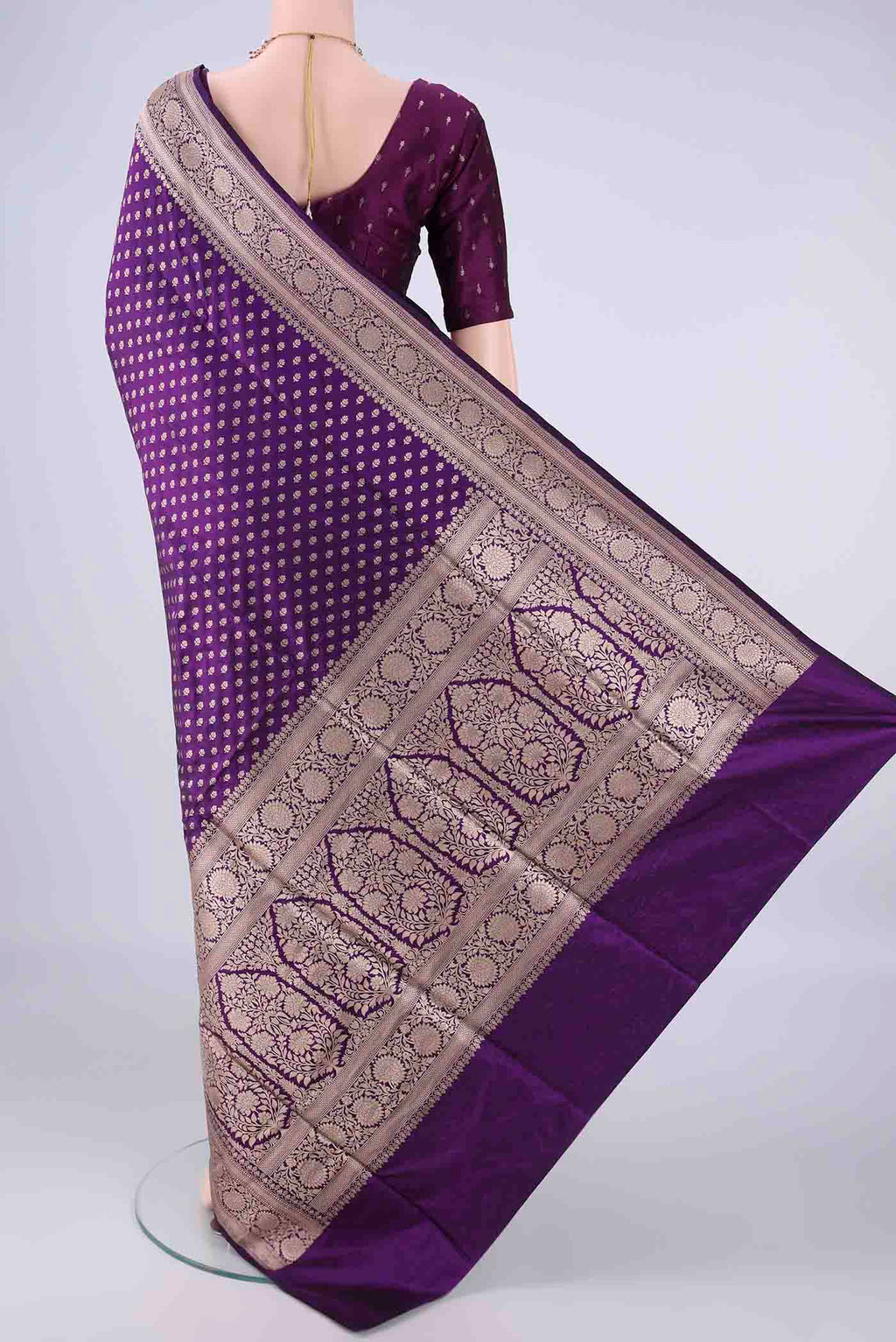Flat view of Purple Banarasi Silk Saree with Zari Butta on the body and Zari Border. 