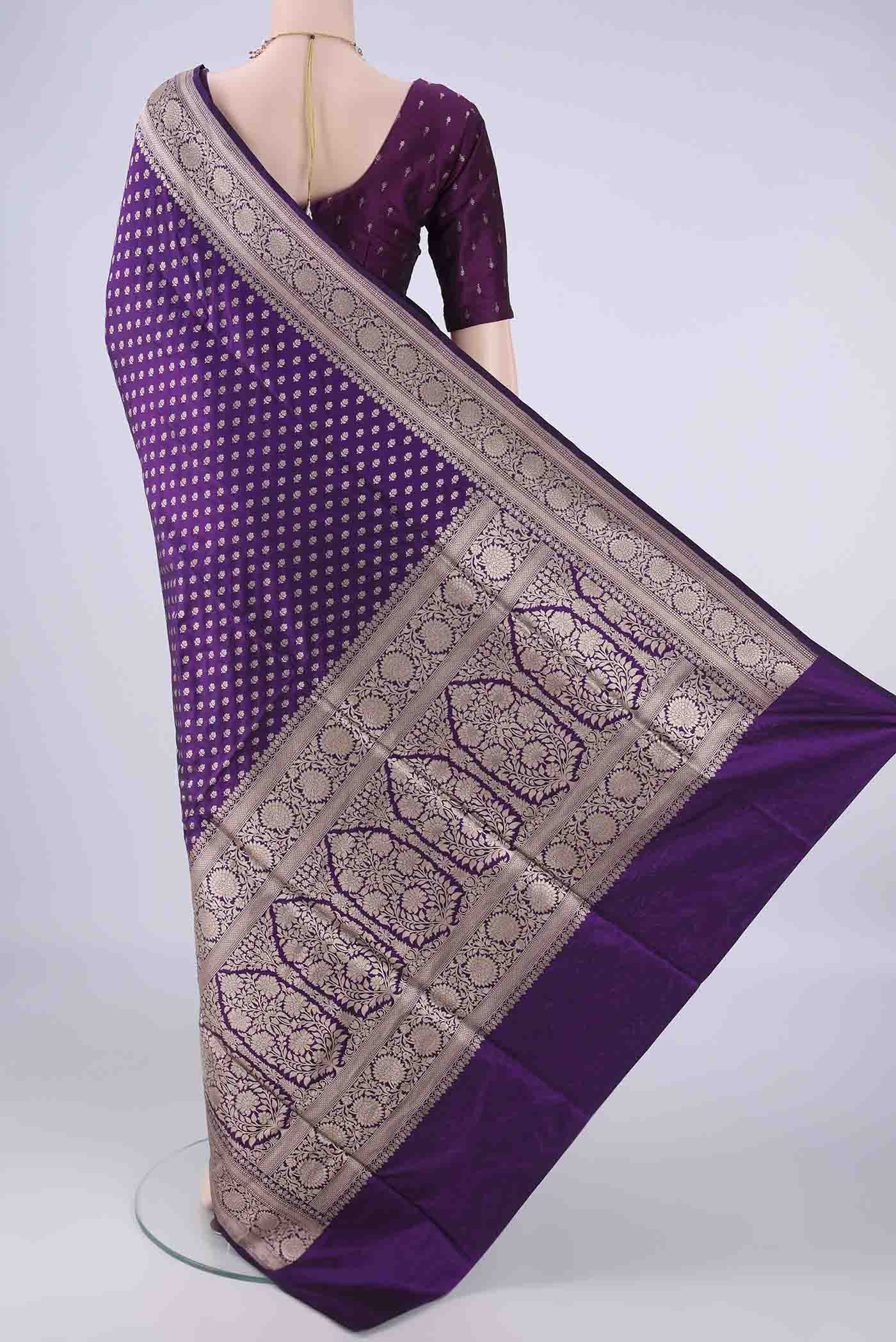 Flat view of Purple Banarasi Silk Saree with Zari Butta on the body and Zari Border. 