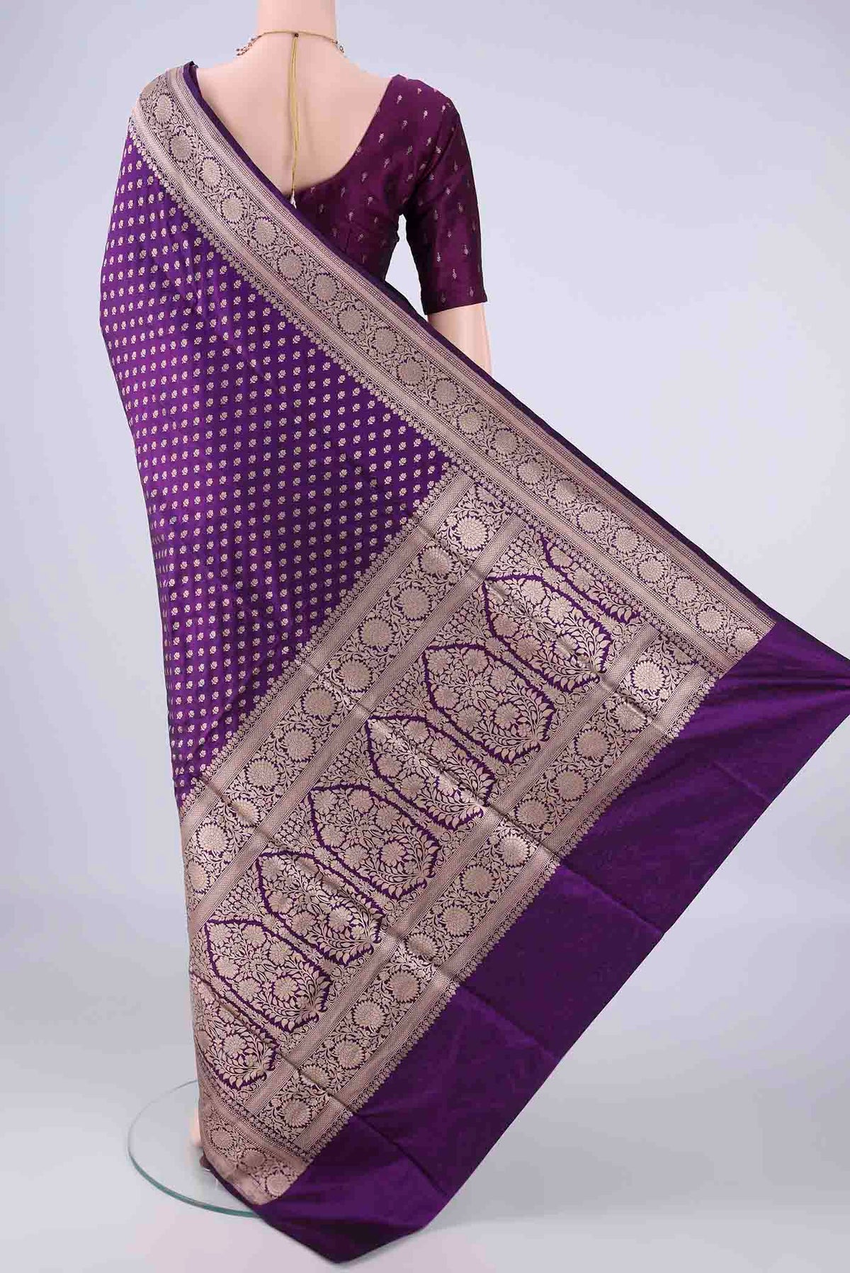 Flat view of Purple Banarasi Silk Saree with Zari Butta on the body and Zari Border. 