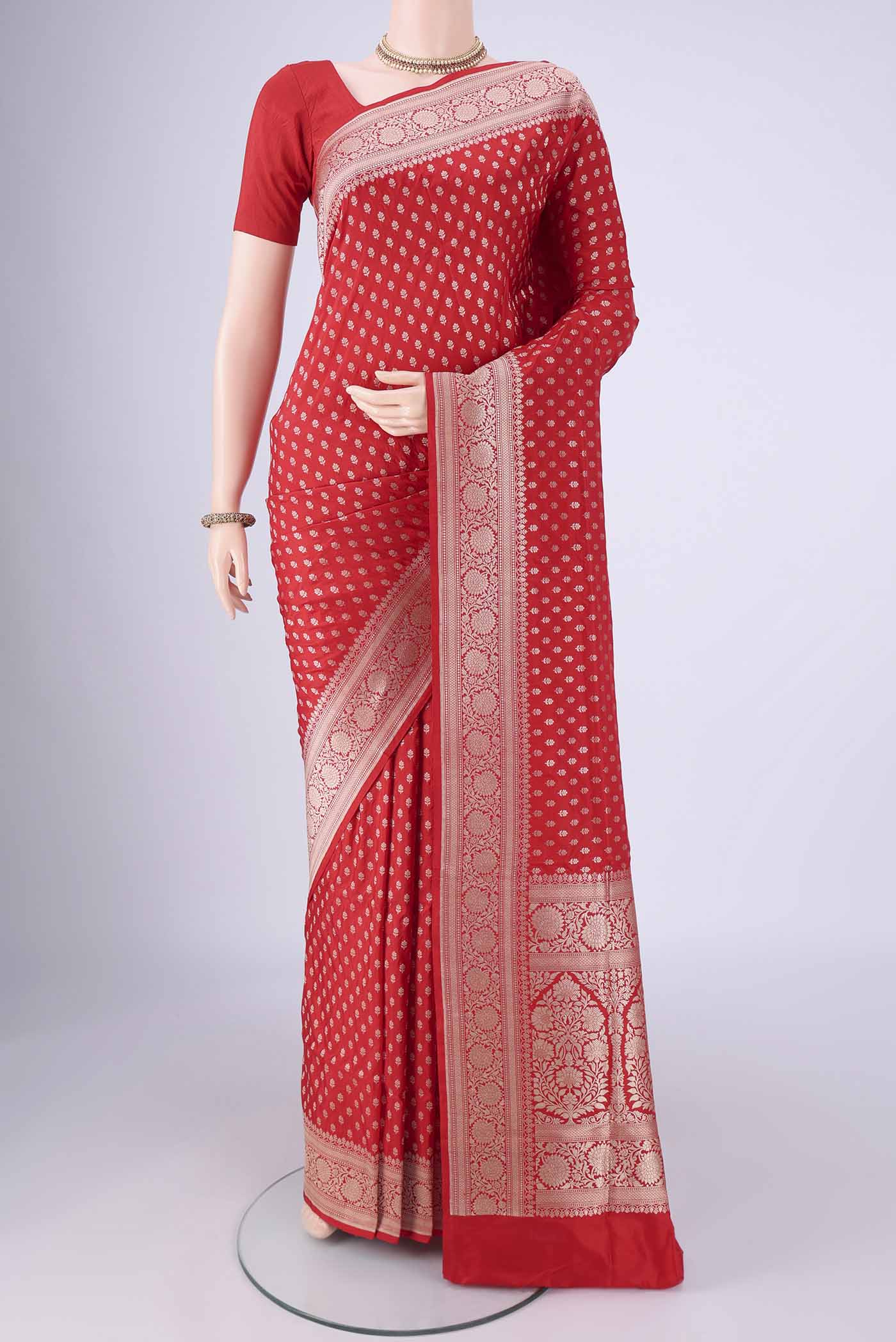 Red Banarasi Silk Saree with Zari Butta on the body and Zari Border.  displayed on a mannequin
