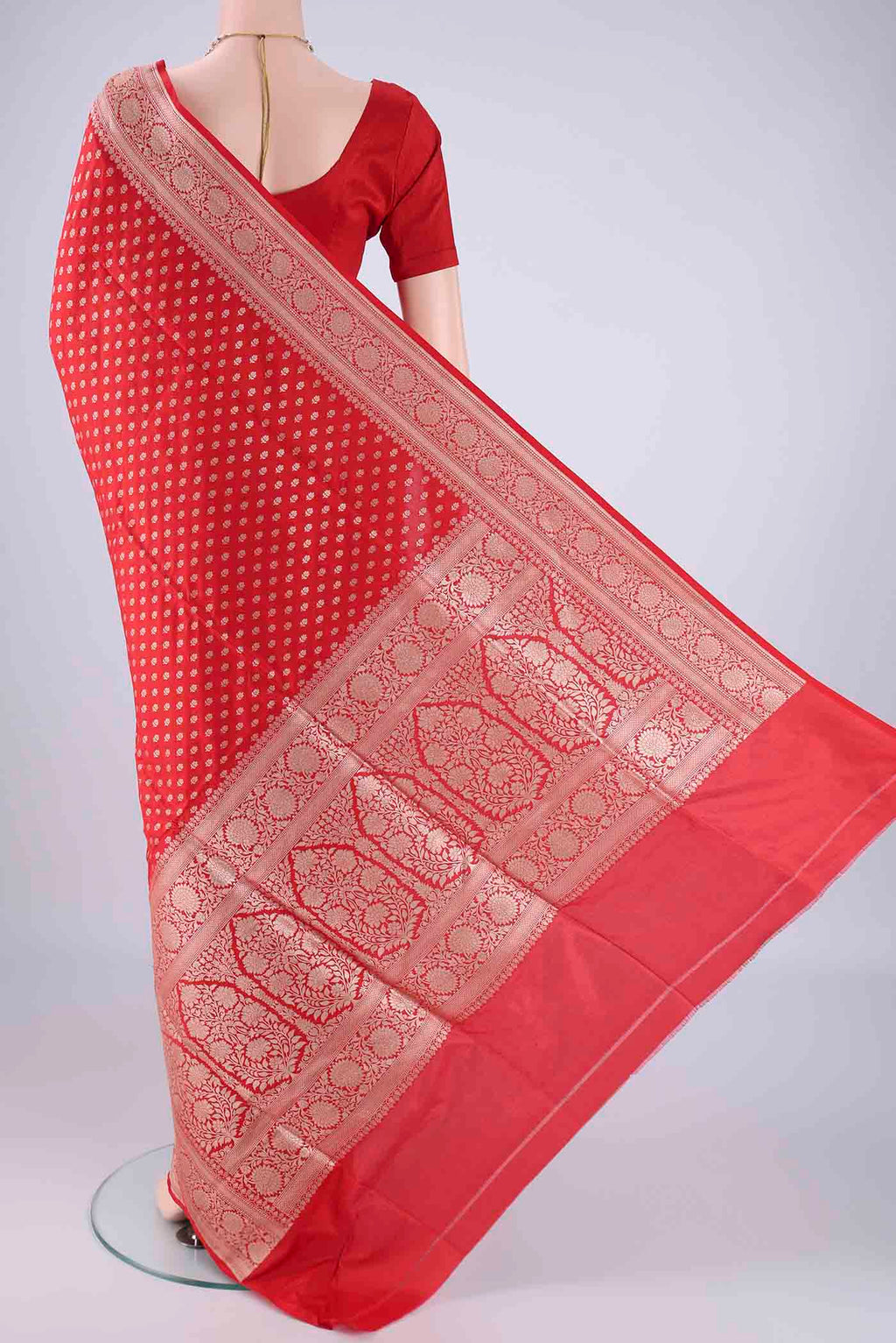 Flat view of Red Banarasi Silk Saree with Zari Butta on the body and Zari Border. 