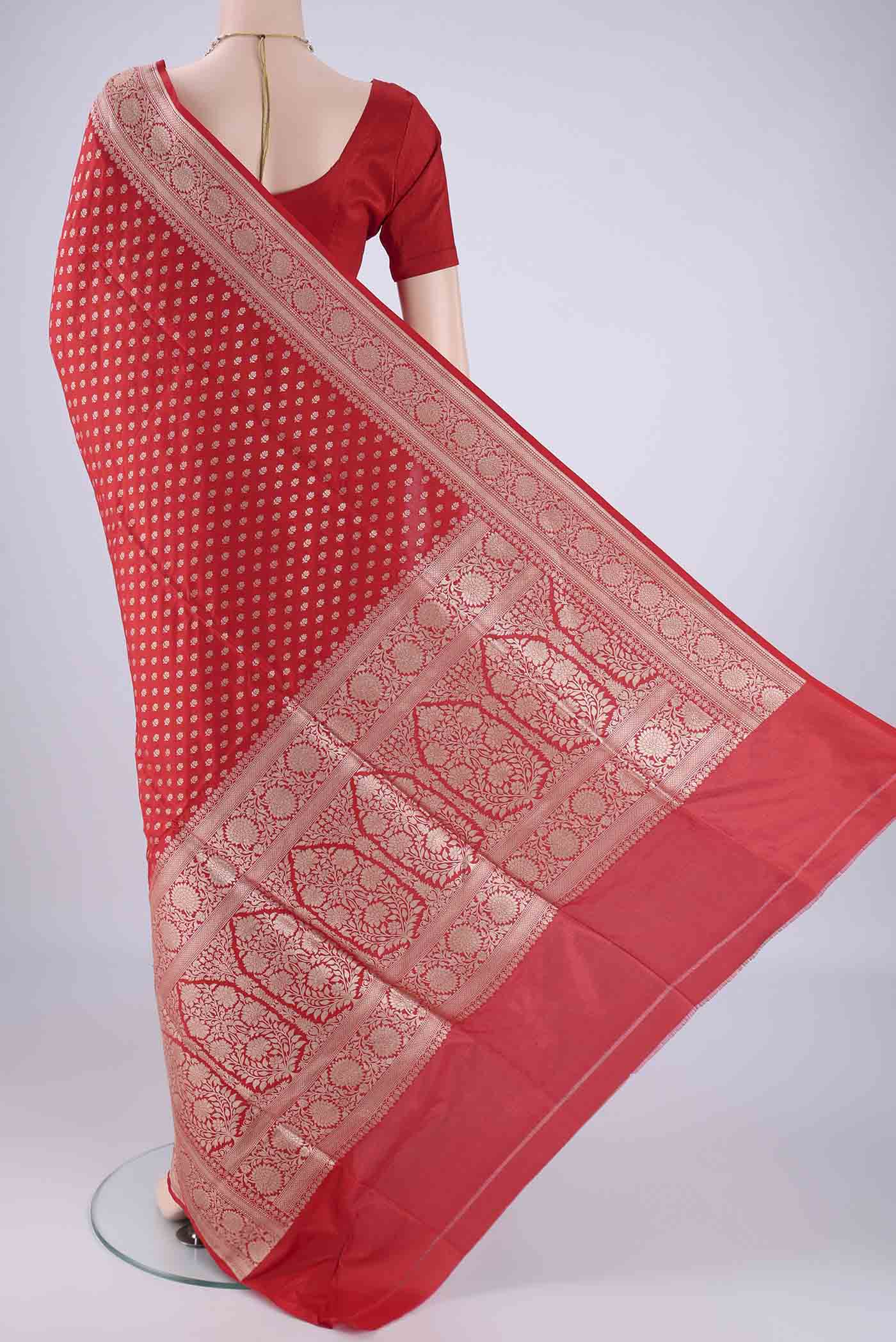 Flat view of Red Banarasi Silk Saree with Zari Butta on the body and Zari Border. 