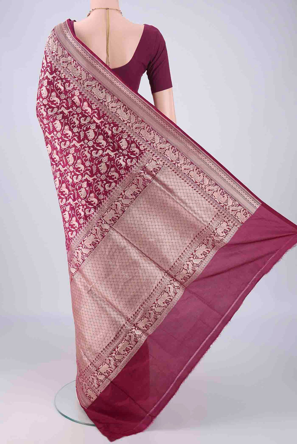 Flat view of Magenta Banarasi Silk Saree with Zari Brocade on the body and Zari Border. 