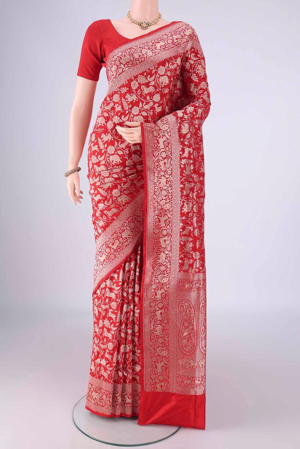 Red Banarasi Silk Saree with Zari Brocade on the body and Zari Border.  displayed on a mannequin